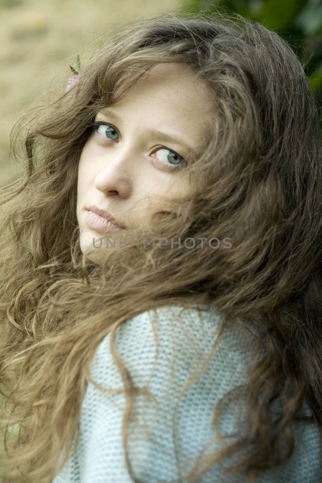 portrait of young woman with worried look by elenarostunova