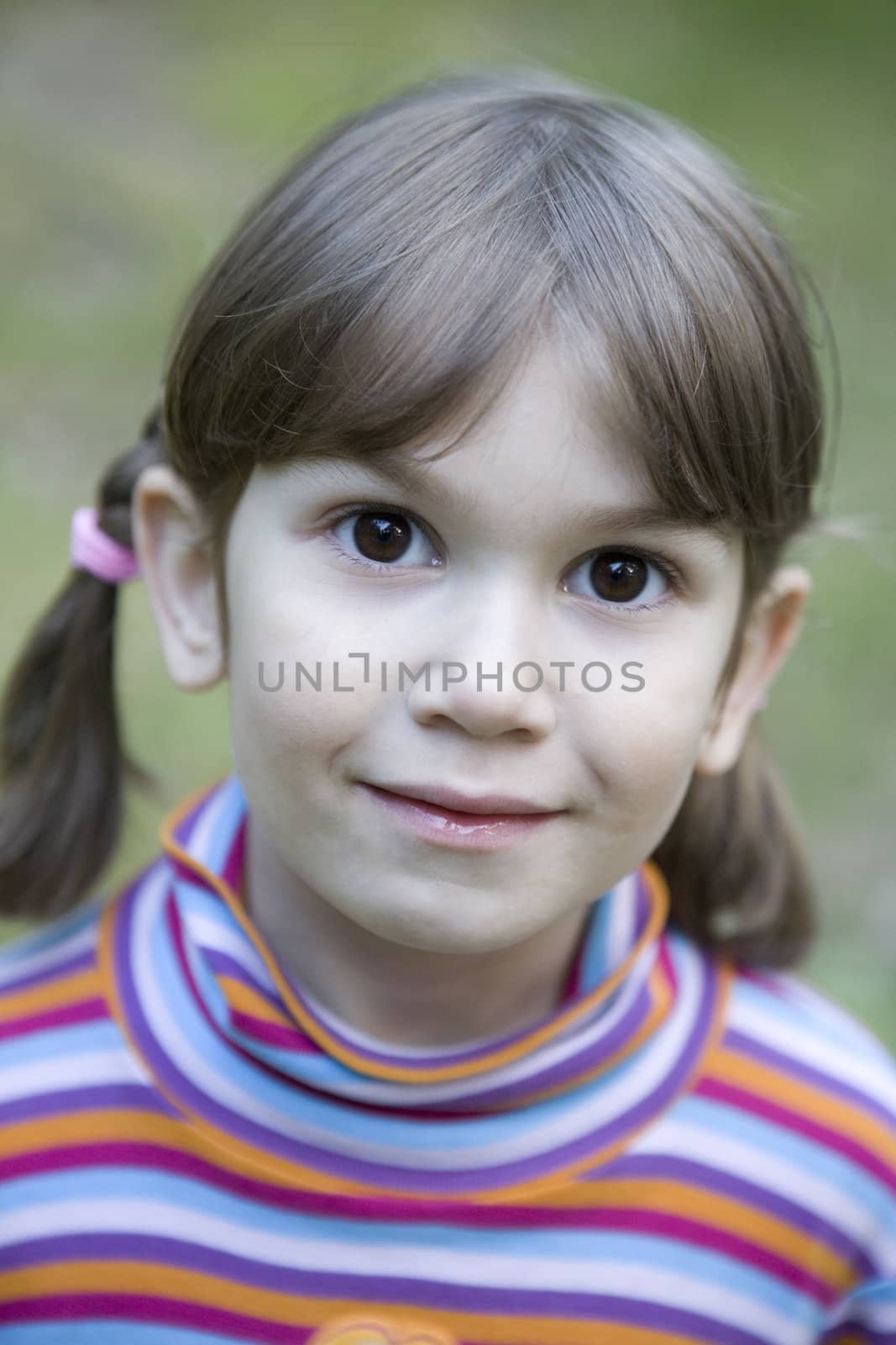 close up portrait cute smiling  girl with funny expression