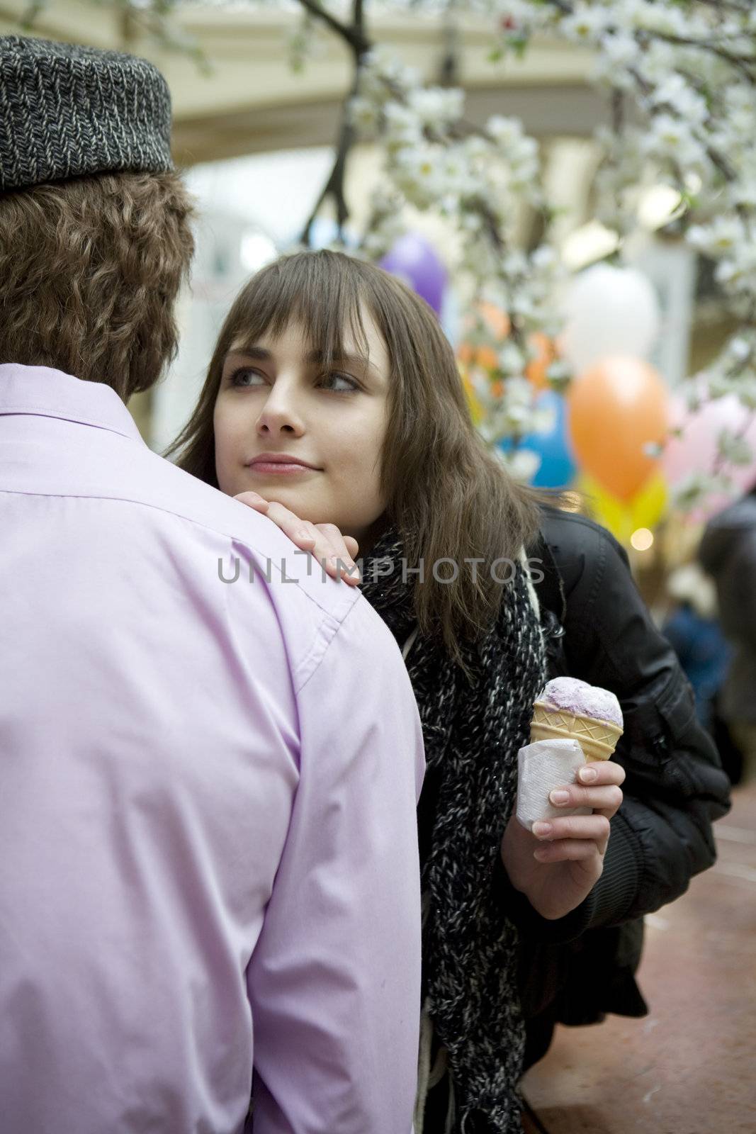 young attractive woman standing with man in state department store. Moscow.