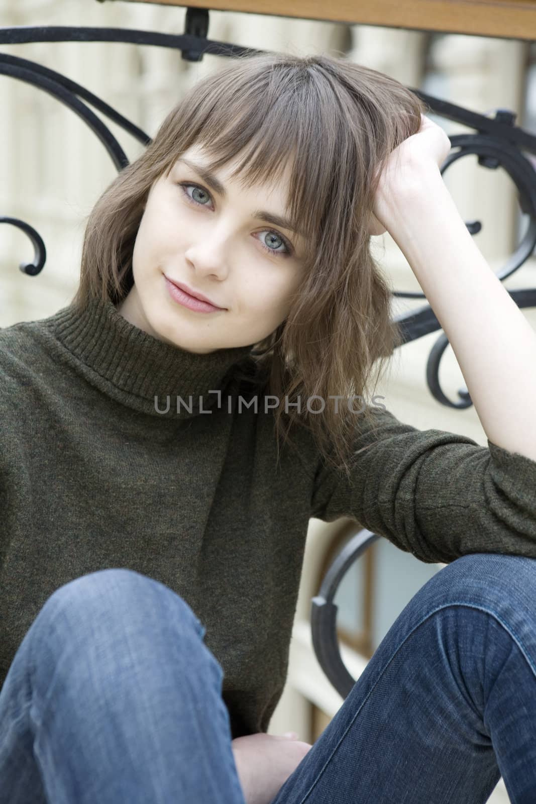 closeup portrait of young serious attractive  woman with green eyes