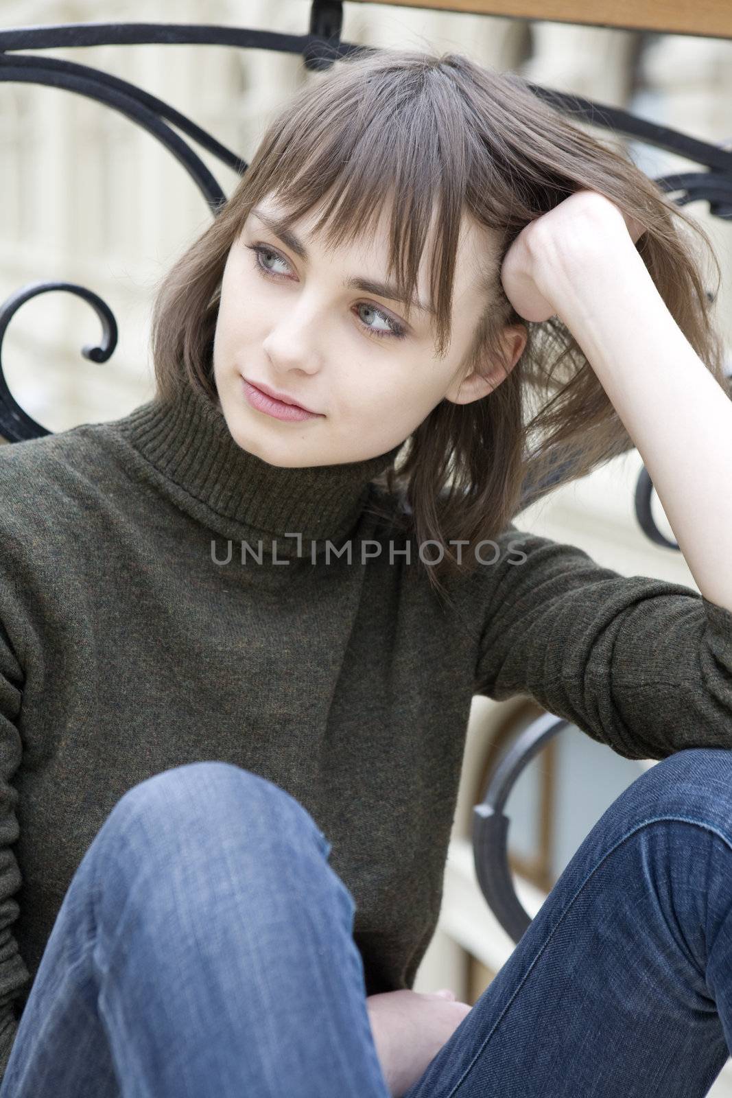 portrait of young serious attractive woman with blue eyes