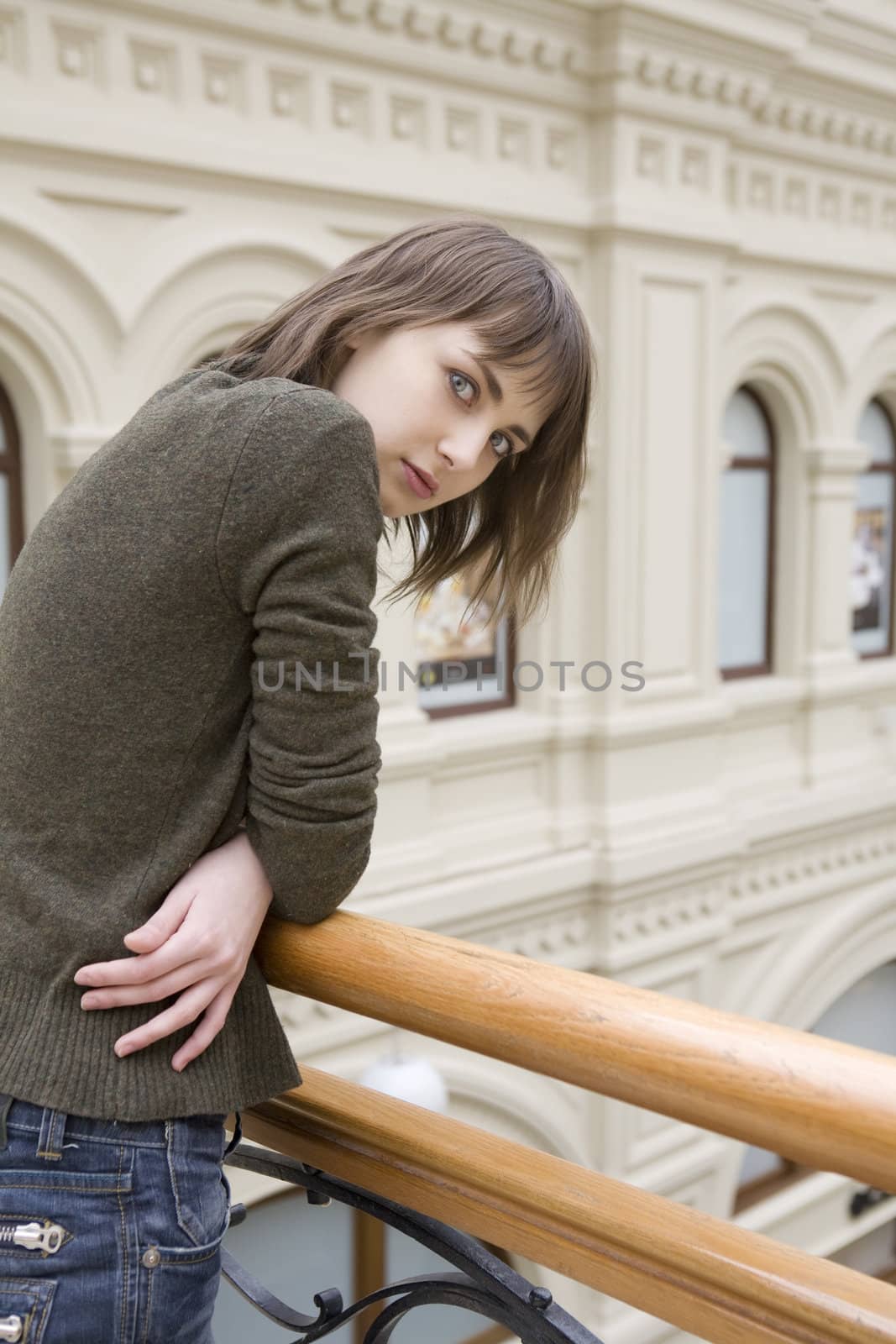  young attractive woman standing at railing in state department  by elenarostunova