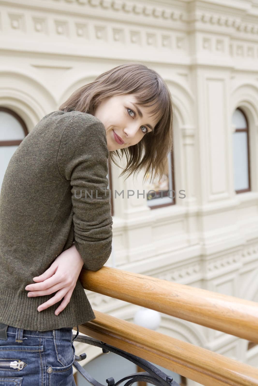  young attractive woman standing at railing in state department store. Moscow
