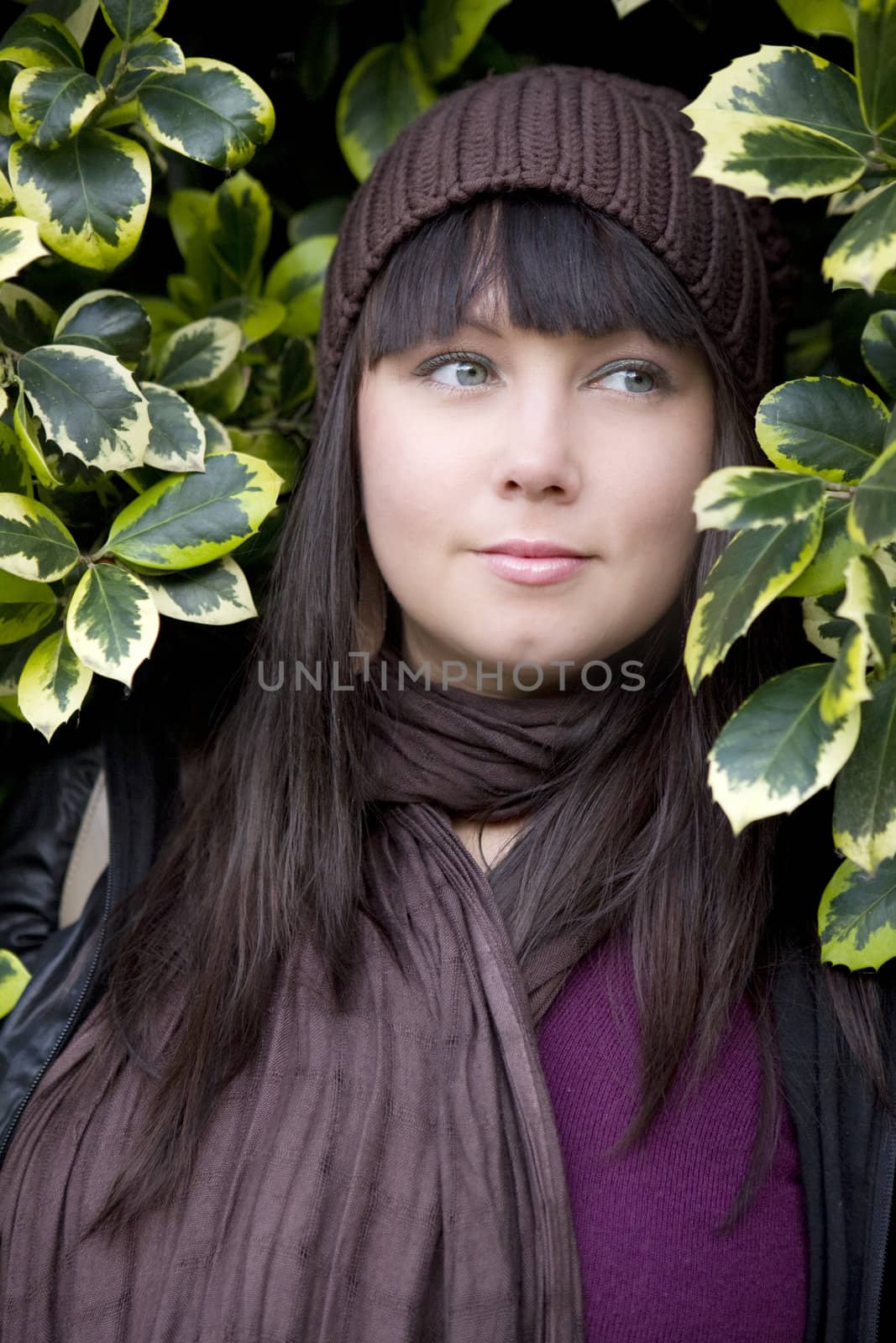 portrait young attractive pensive woman wearing cap standing in  by elenarostunova