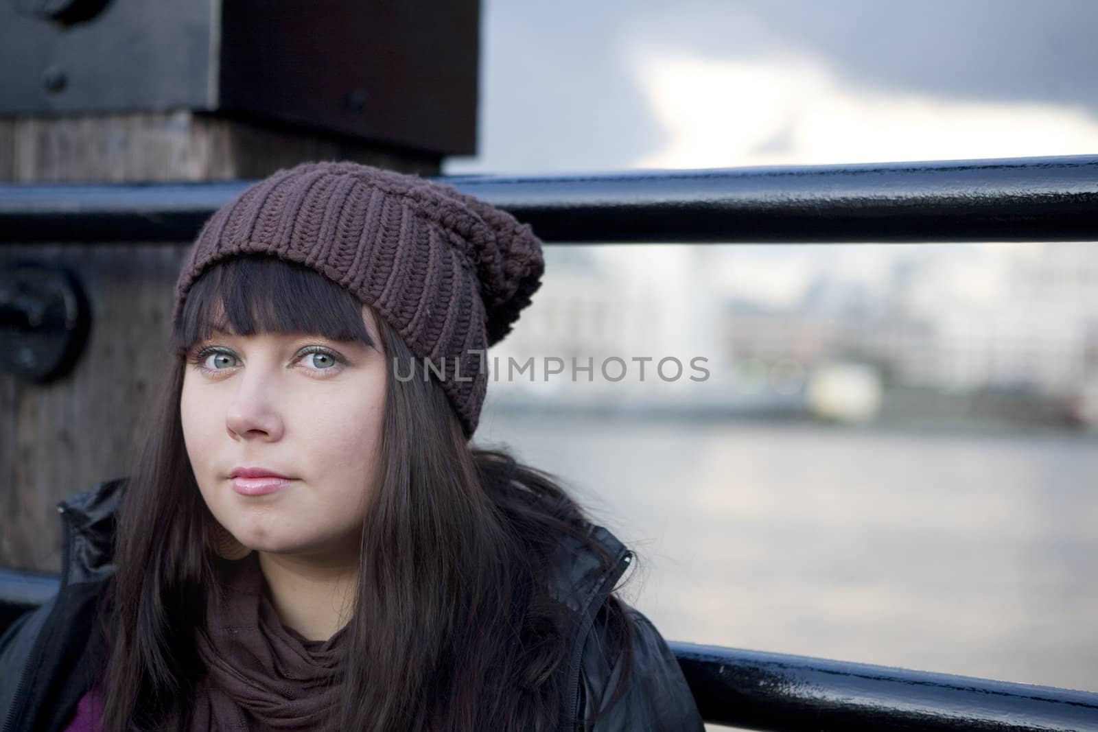 closeup portrait of young serious attractive woman with wide ope by elenarostunova