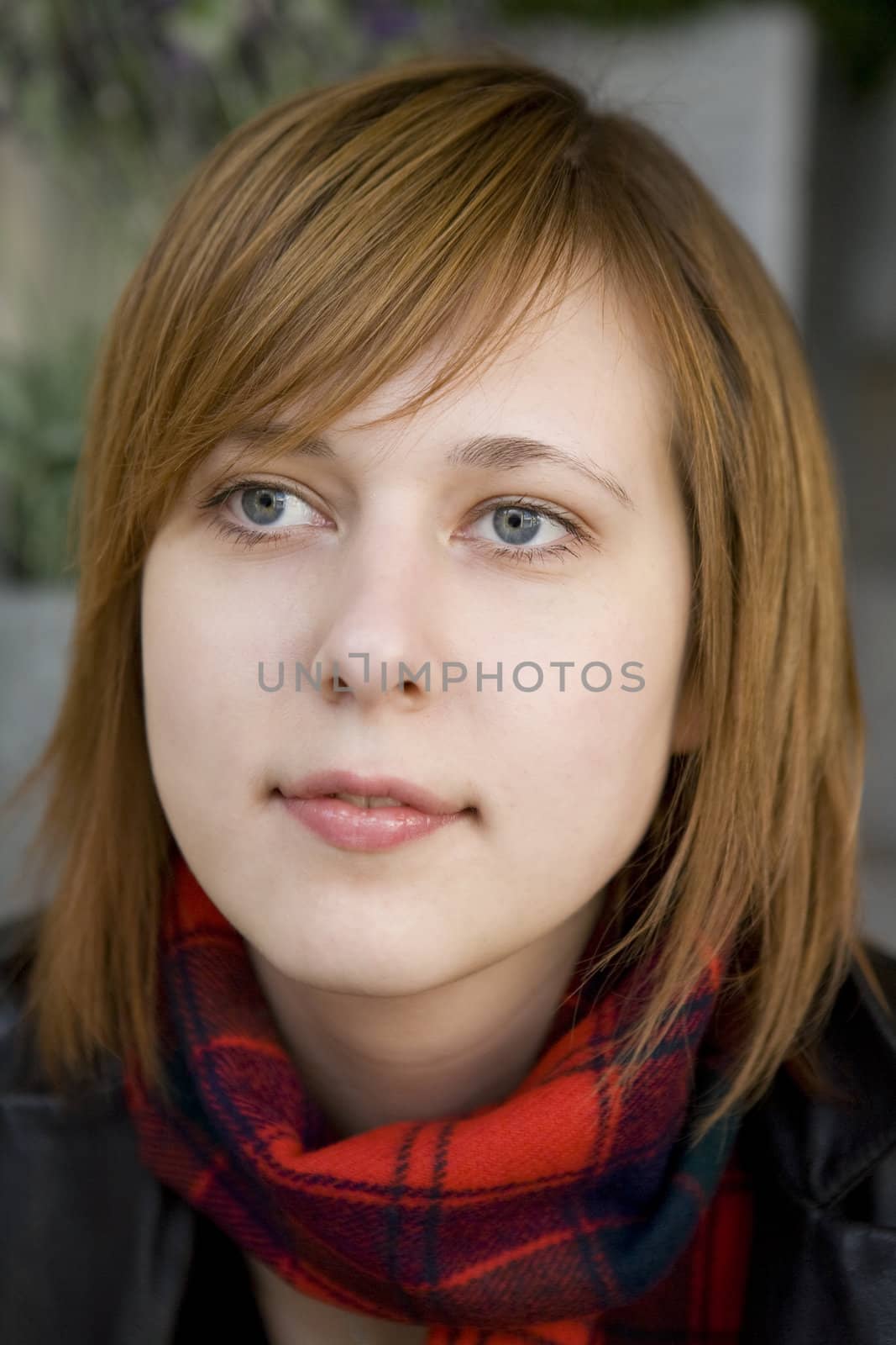 closeup portrait of young serious attractive woman with blue eye by elenarostunova