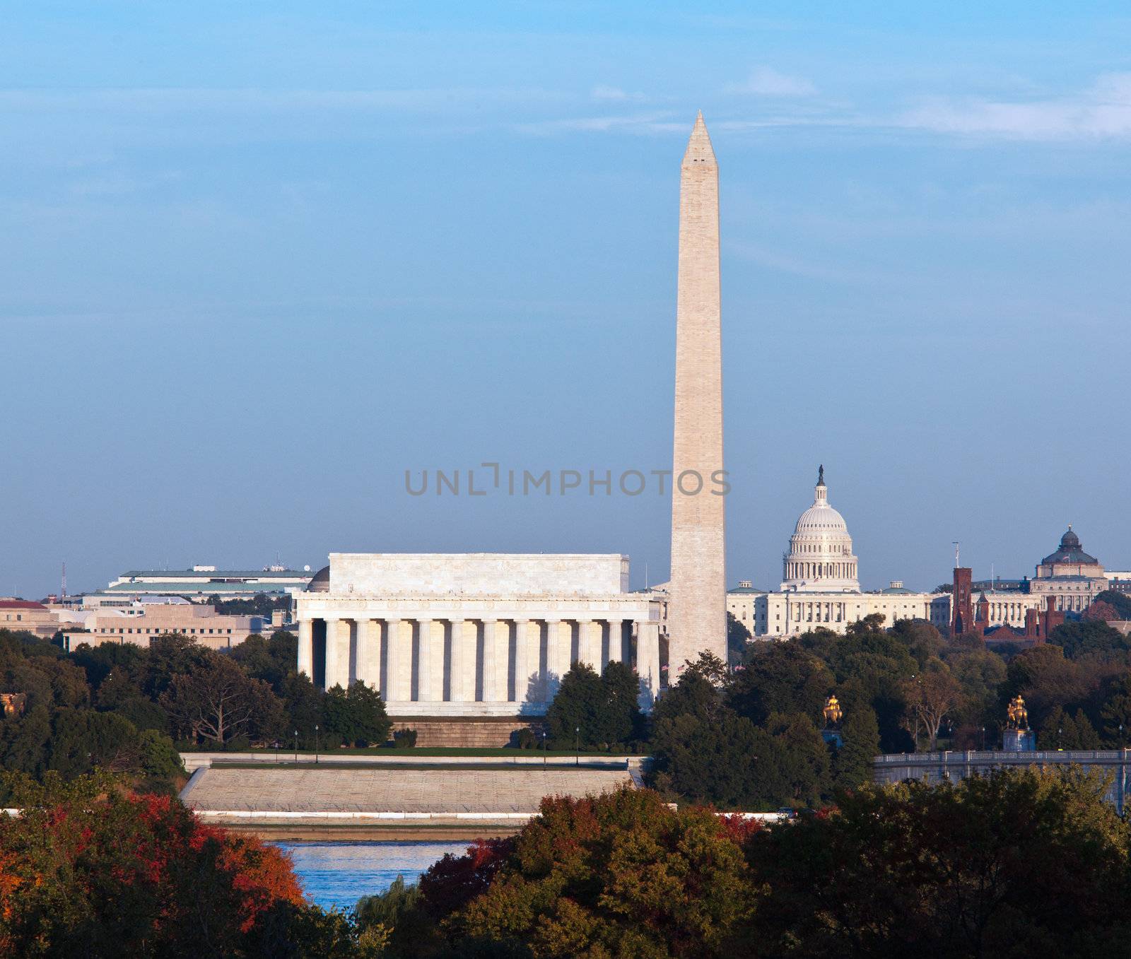 Lincoln Memorial, Washington Monument and Capitol building aligned as the sun starts to set in the fall