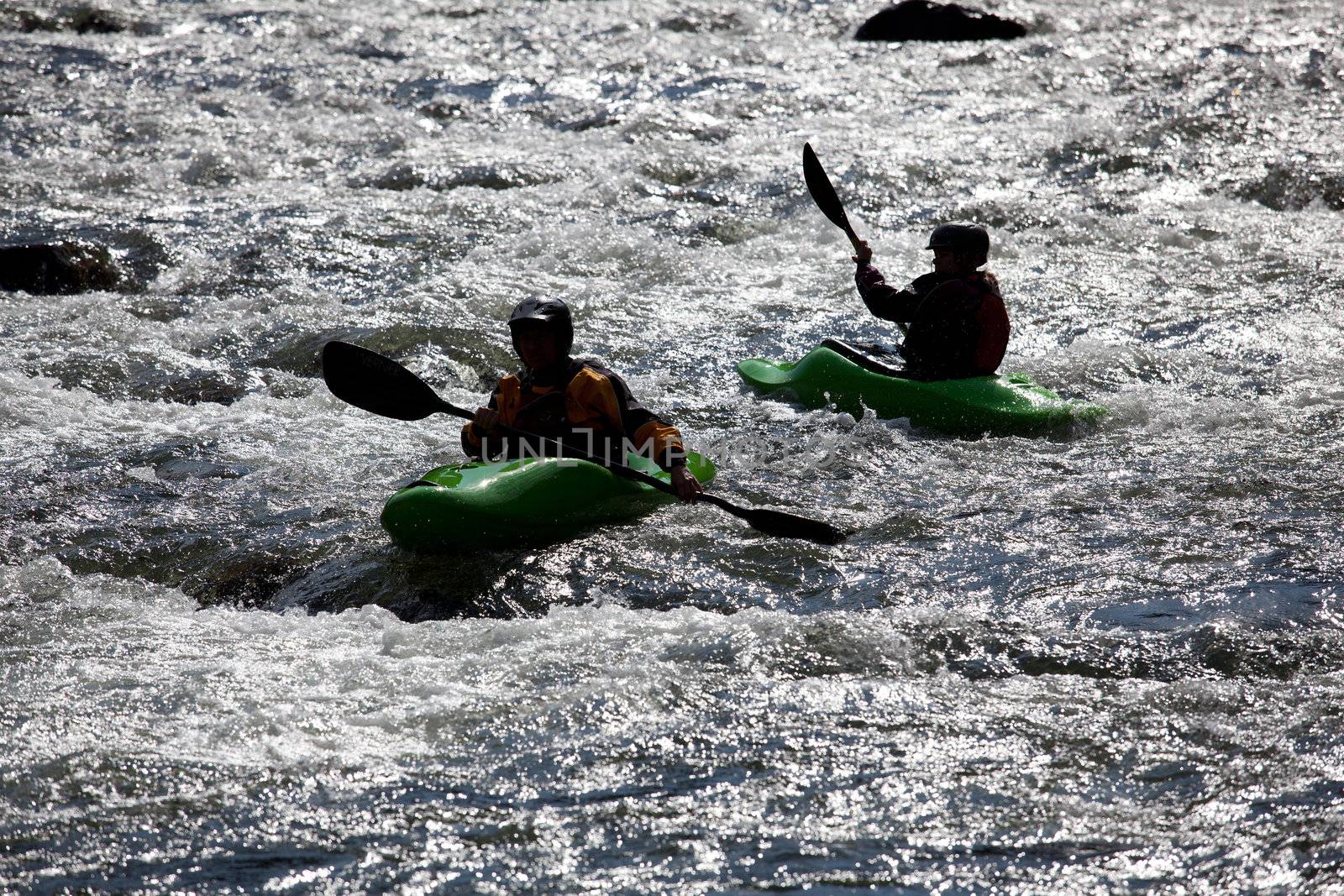 Canoeing in white water in rapids on river