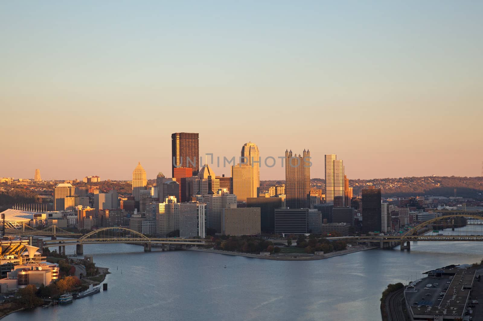 Setting sun highlights the tops of the tall buildings in downtown Pittsburgh