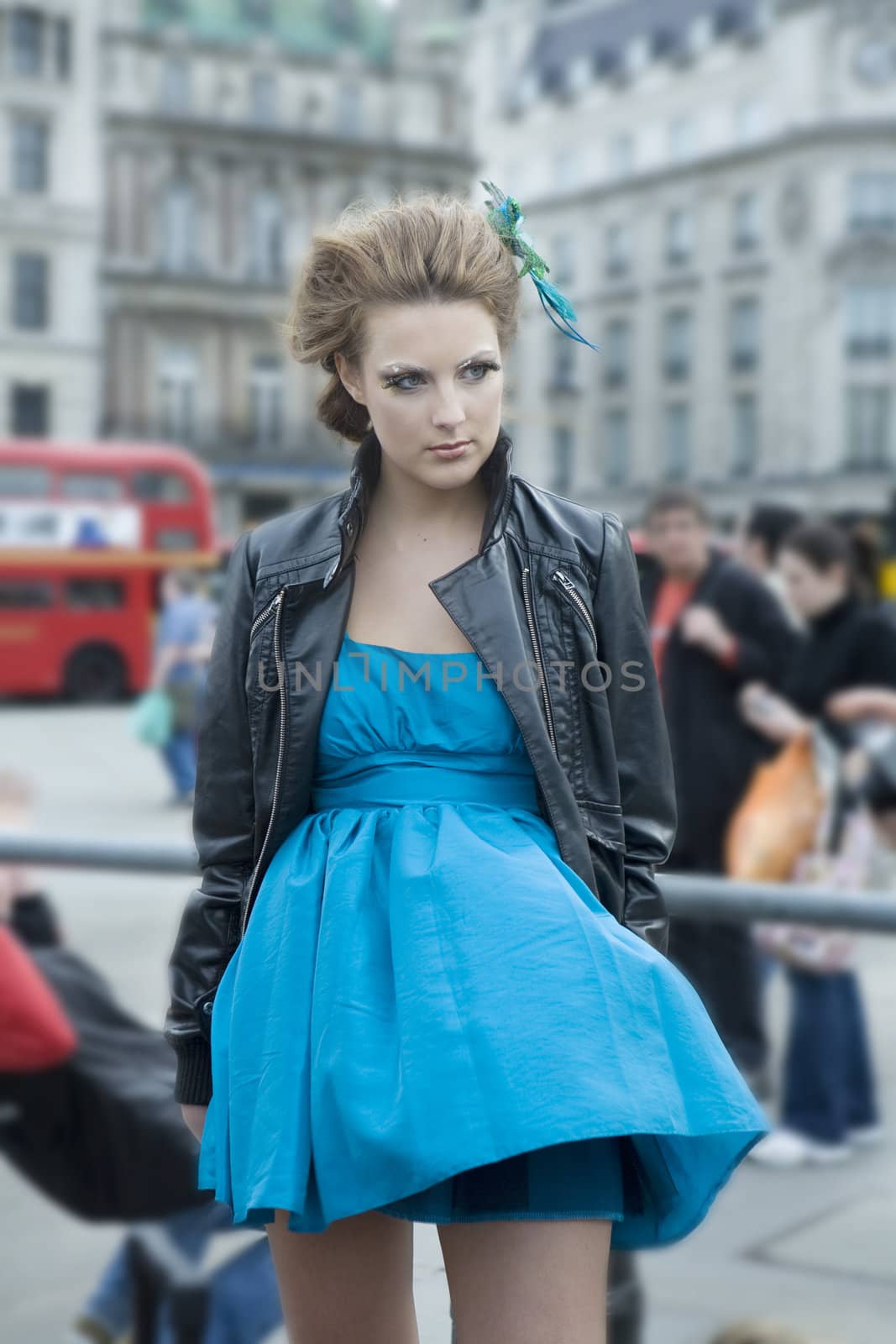 attrractive woman in blue dress posing front camera by elenarostunova