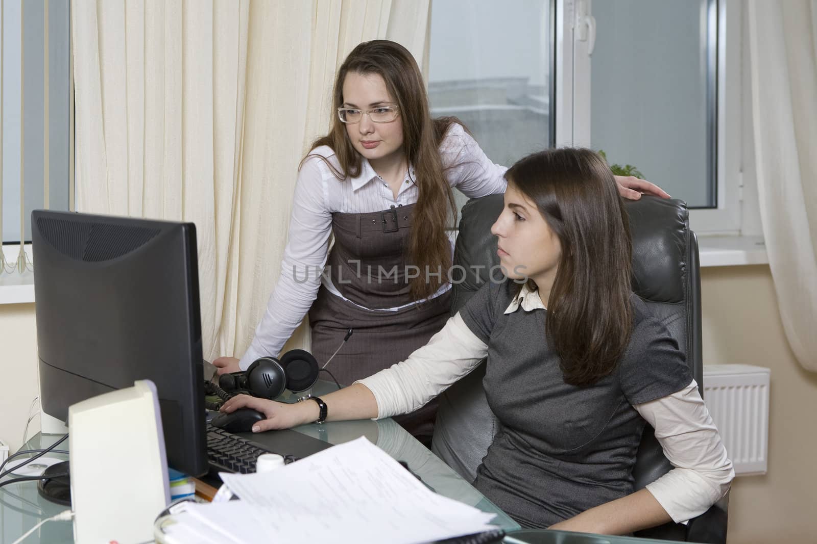 Group of 2 business people working together in the office. by elenarostunova