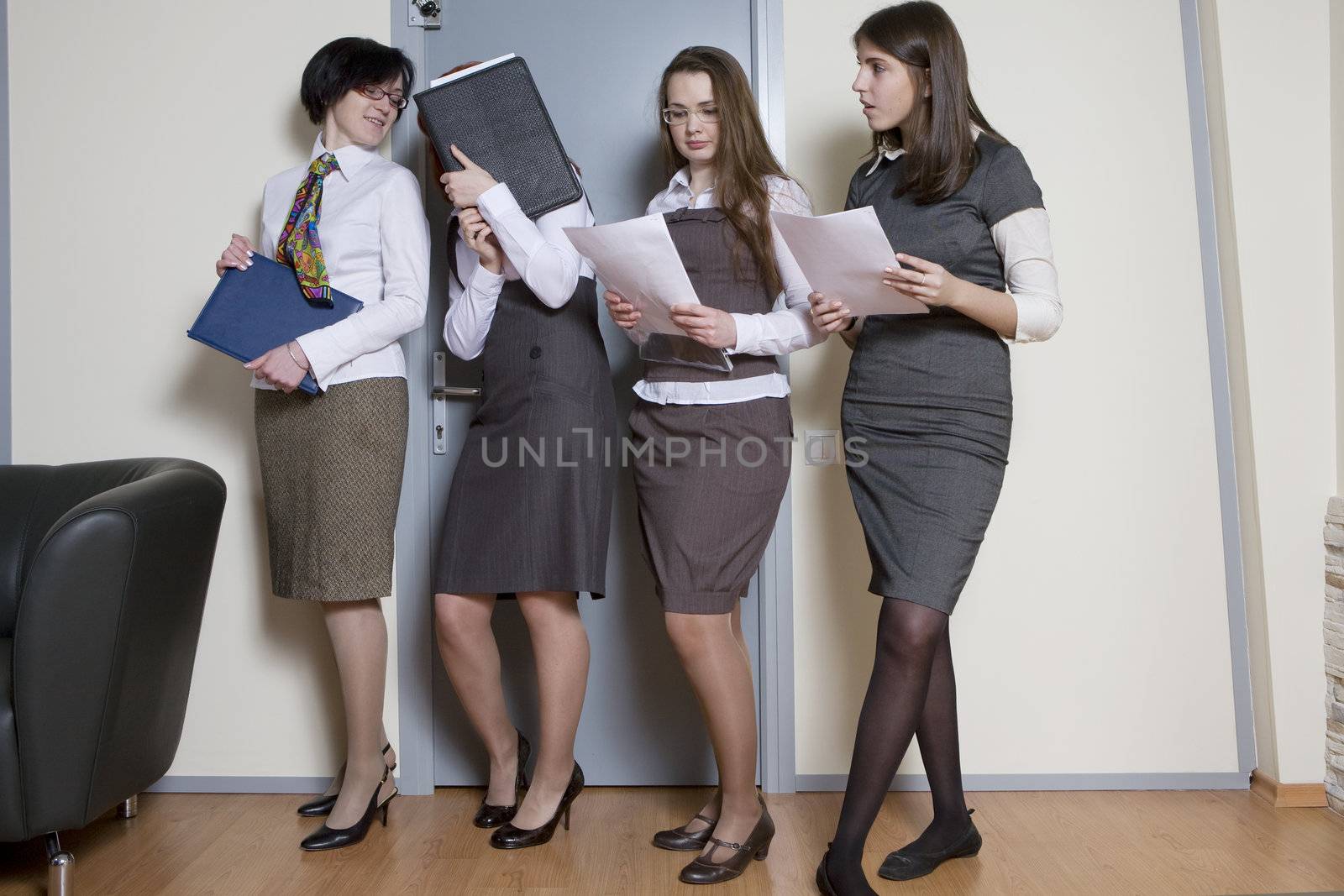 Secretaries waiting for boss ready for report. Businesswoman leading a business team in an office 
