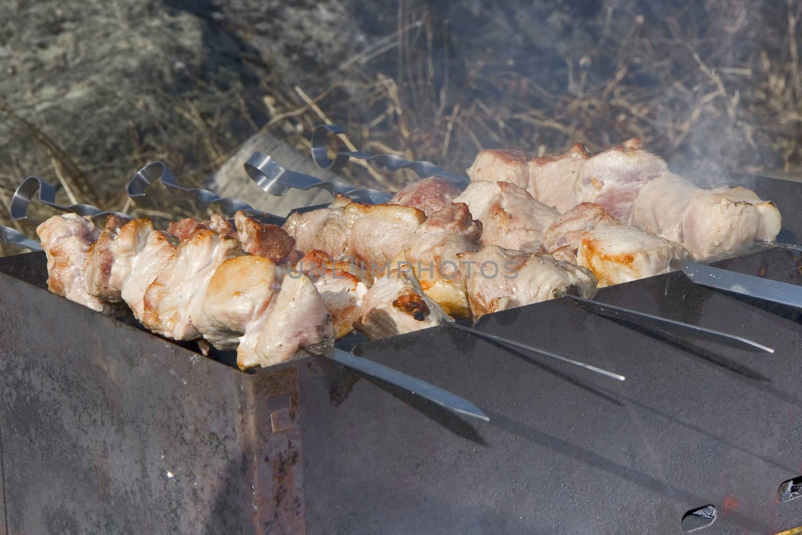 Photo of a shish kebab fried on a brazier