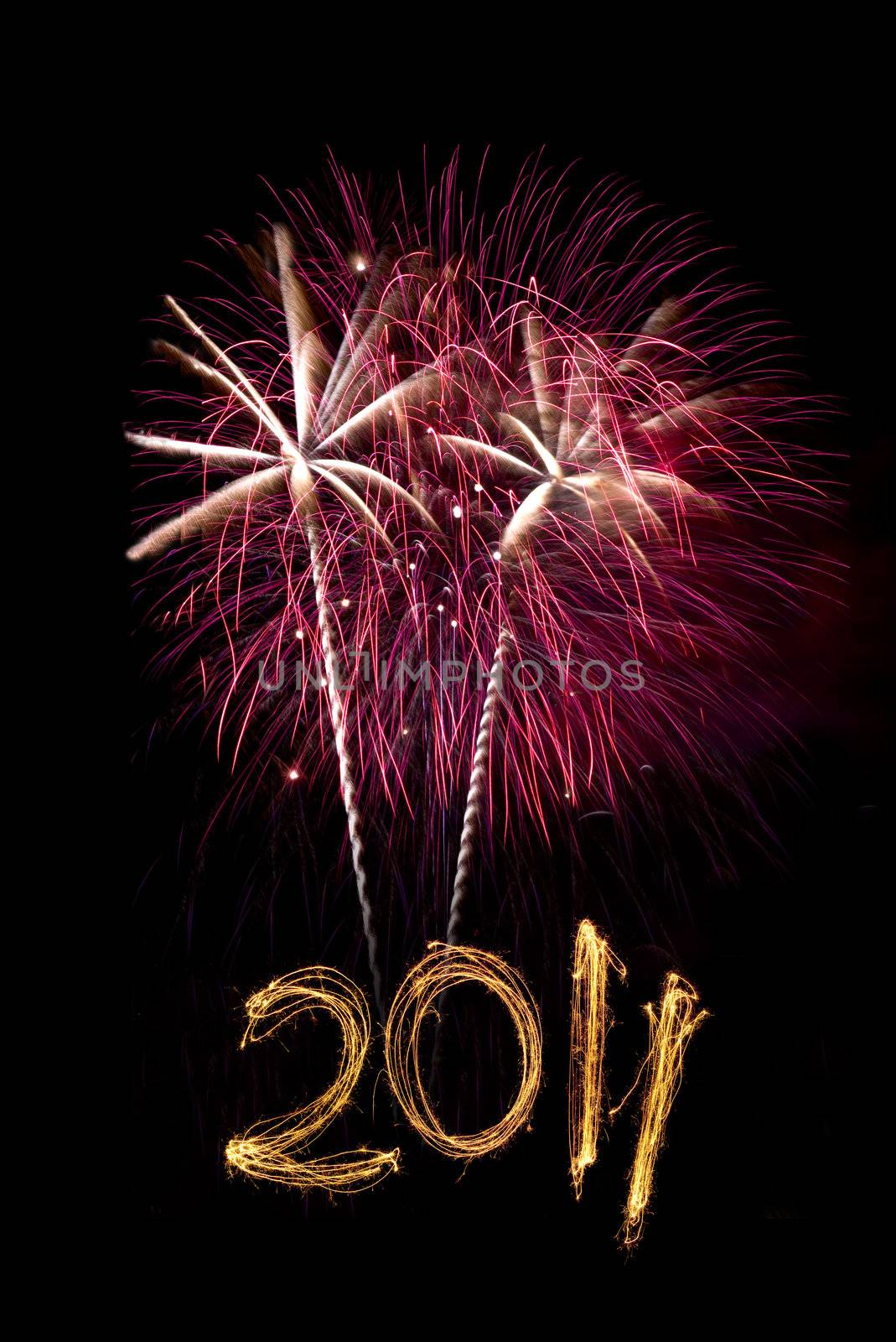 Pink and white exploding fireworks with 2011 written with lit sparklers. Could be used for New Year and Fourth of July. Space for poster copy.
