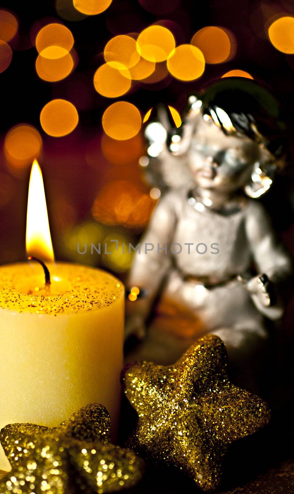 Christmas Angel staring at a burning candle. Rear Bokeh plan created by the filter, not  Photoshop.