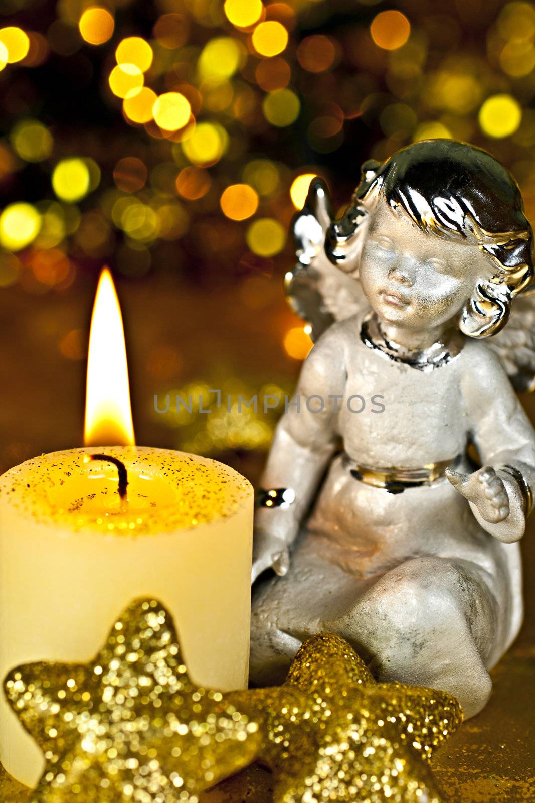 Christmas Angel staring at a burning candle. Rear Bokeh plan created by the filter, not  Photoshop.
