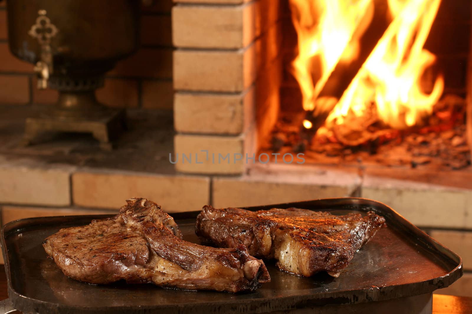 Meat on a bone, fried on a lattice at restaurant