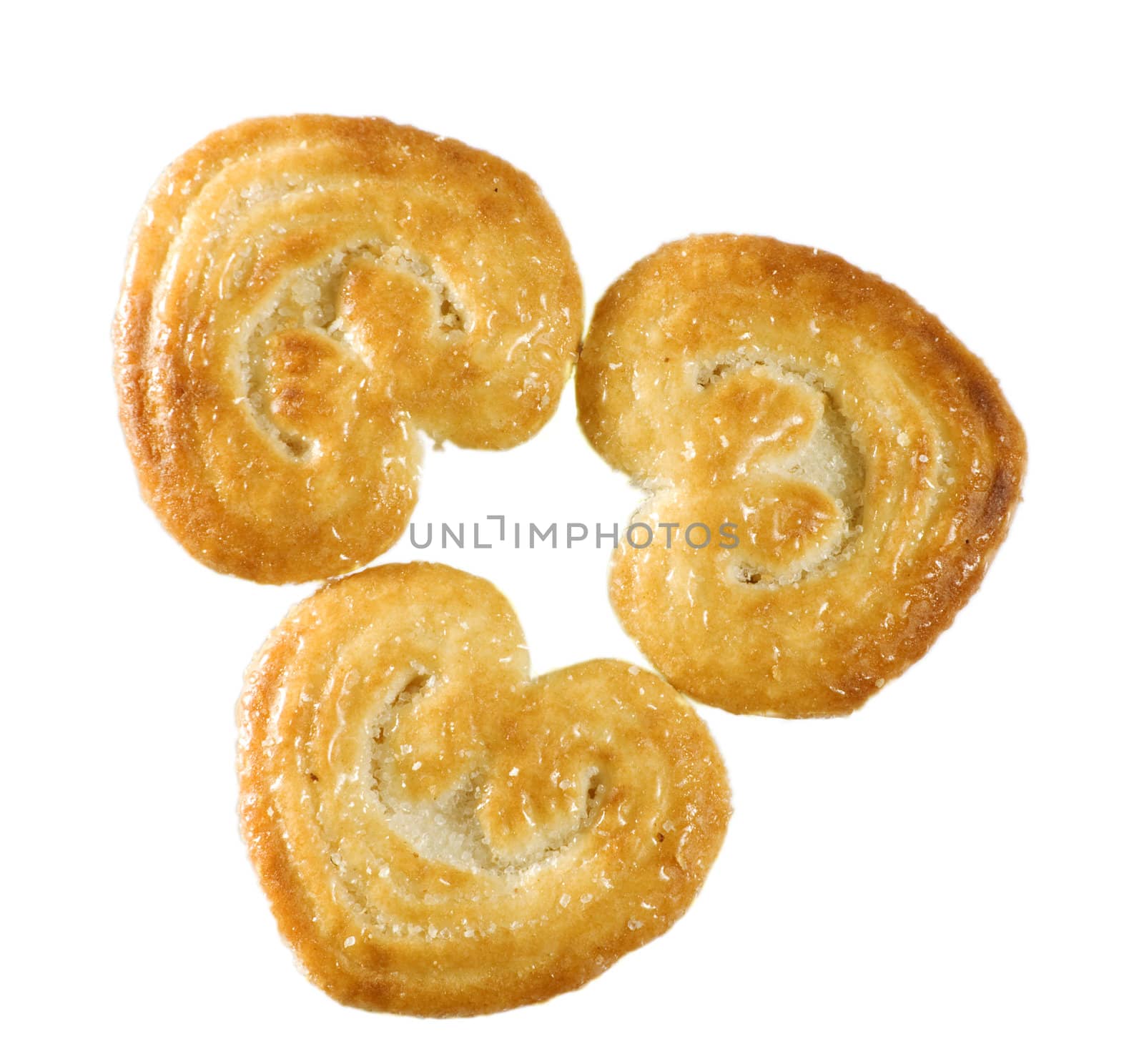 Three cookies with sugar. White background.