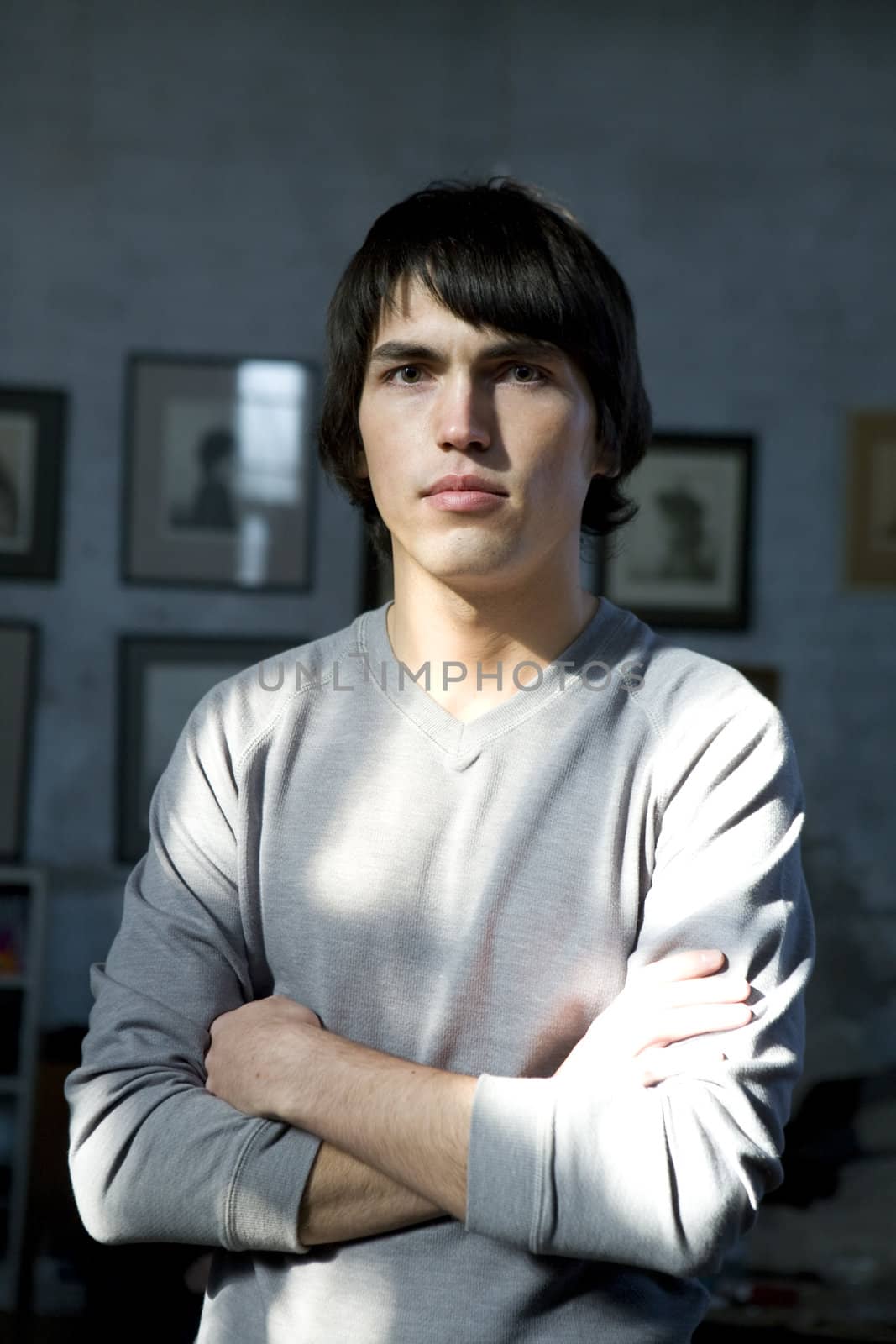 close up portrait of young serious handsome man.