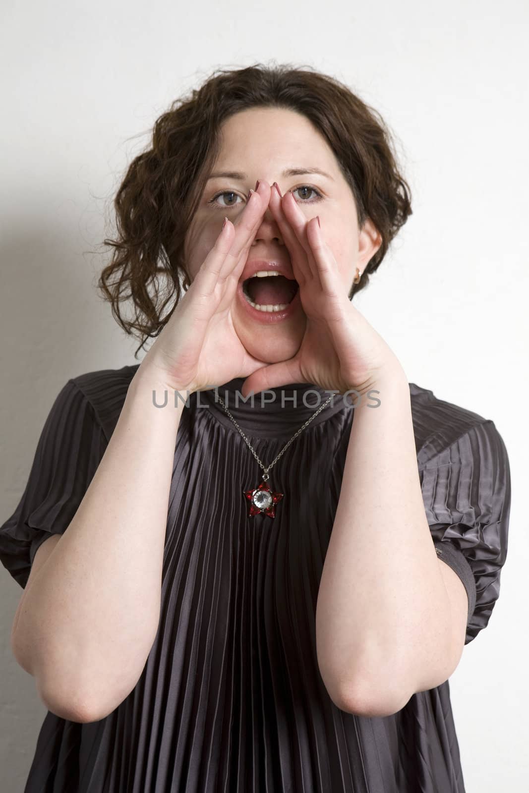 Young adorable woman shouting. White background