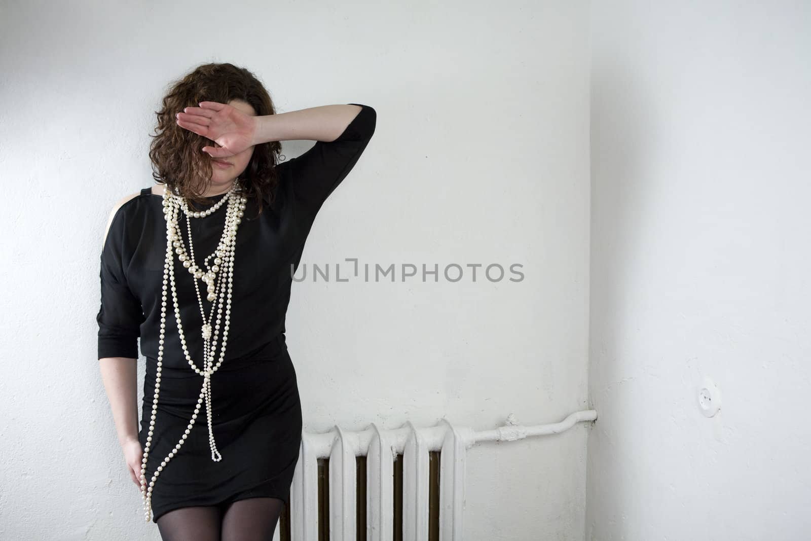 Young upset woman in pearls beads by elenarostunova