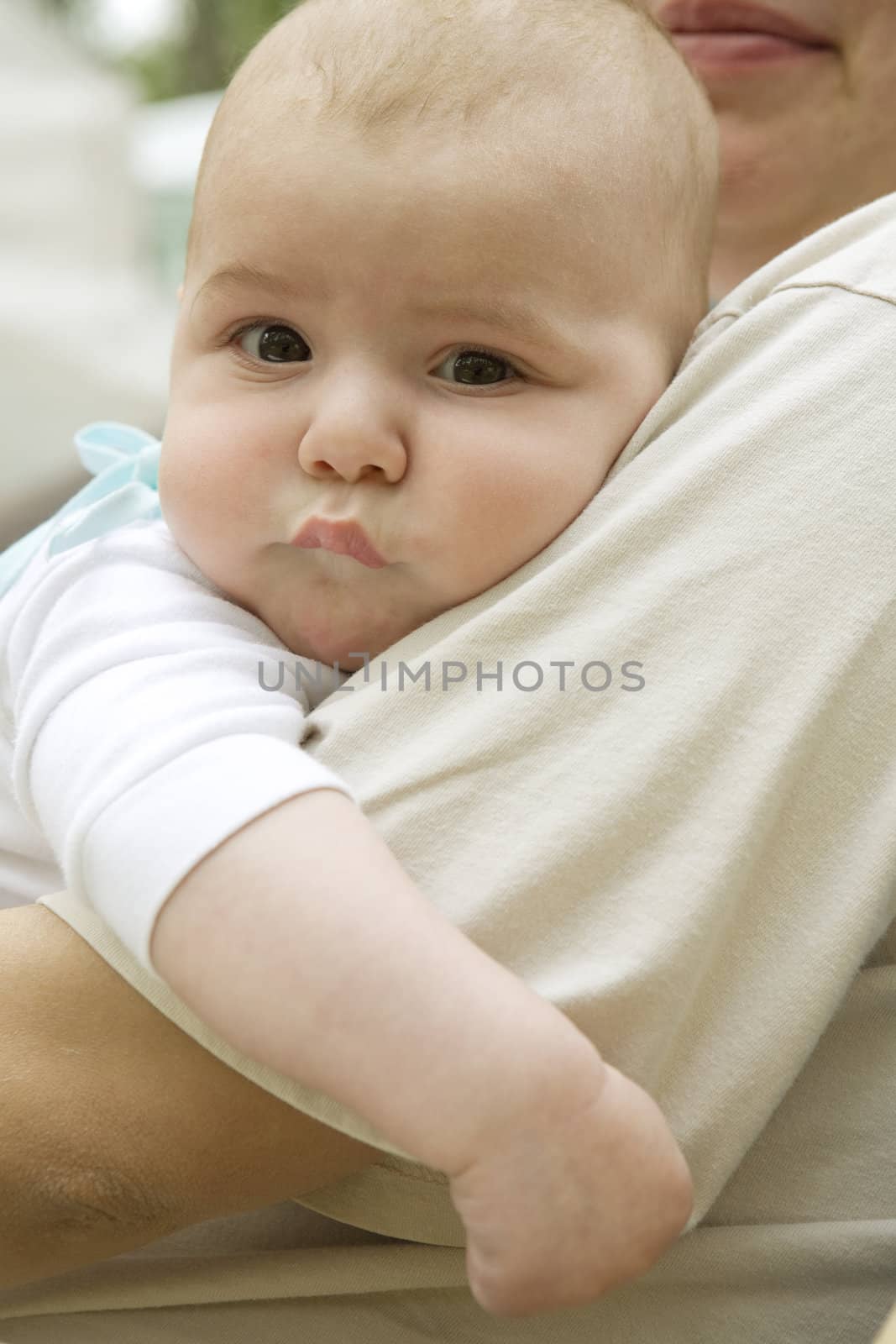 Portrait of happy serious pensive newborn baby by elenarostunova