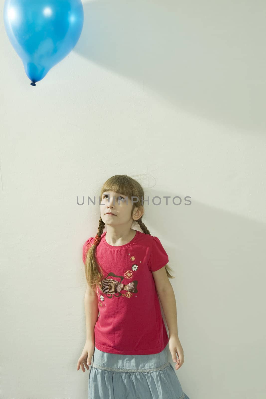 young happy girl playing with colour balloons by elenarostunova