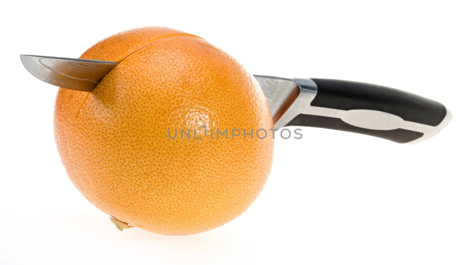 Grapefruit with damascus steel knife over isolated on white