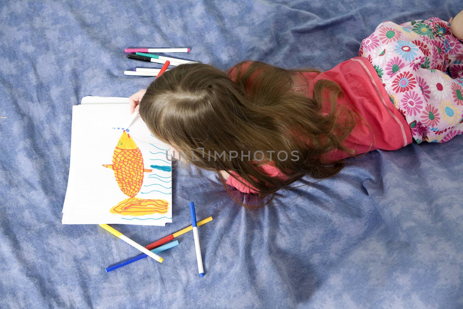 little cute smiling girl seven years old with drawing picture by elenarostunova