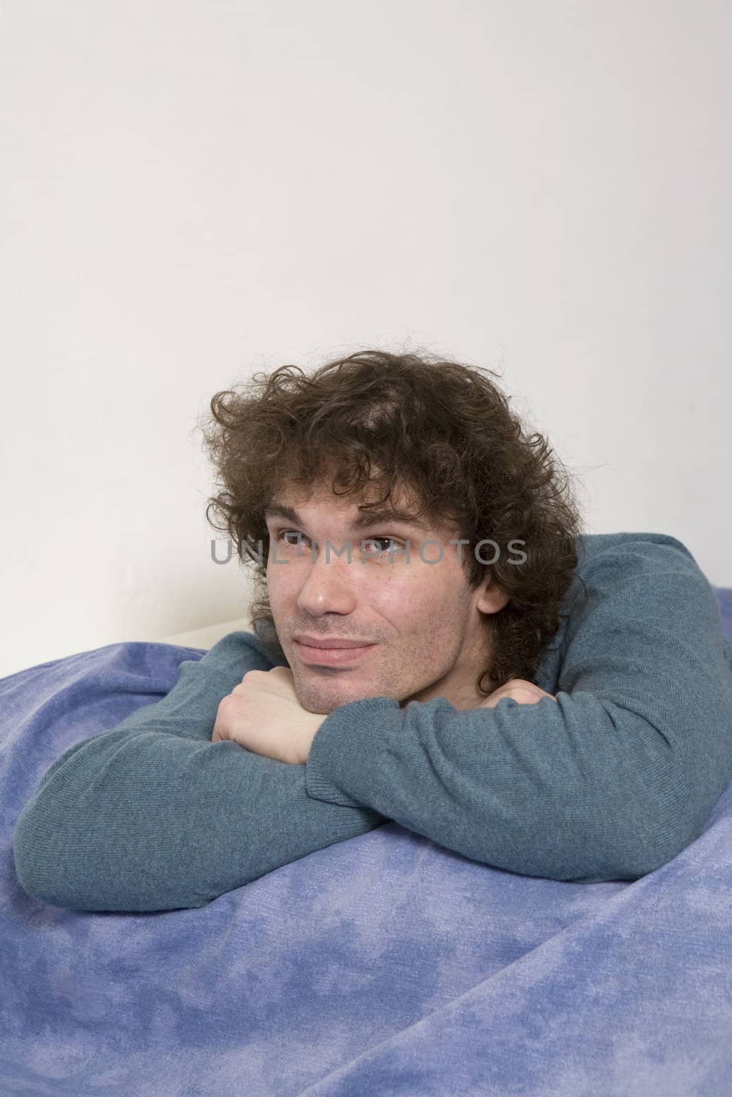 portrait middle-age pensive sitting man. White background by elenarostunova