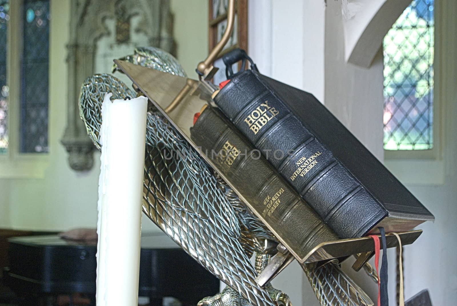 Bible and candle in pulpit