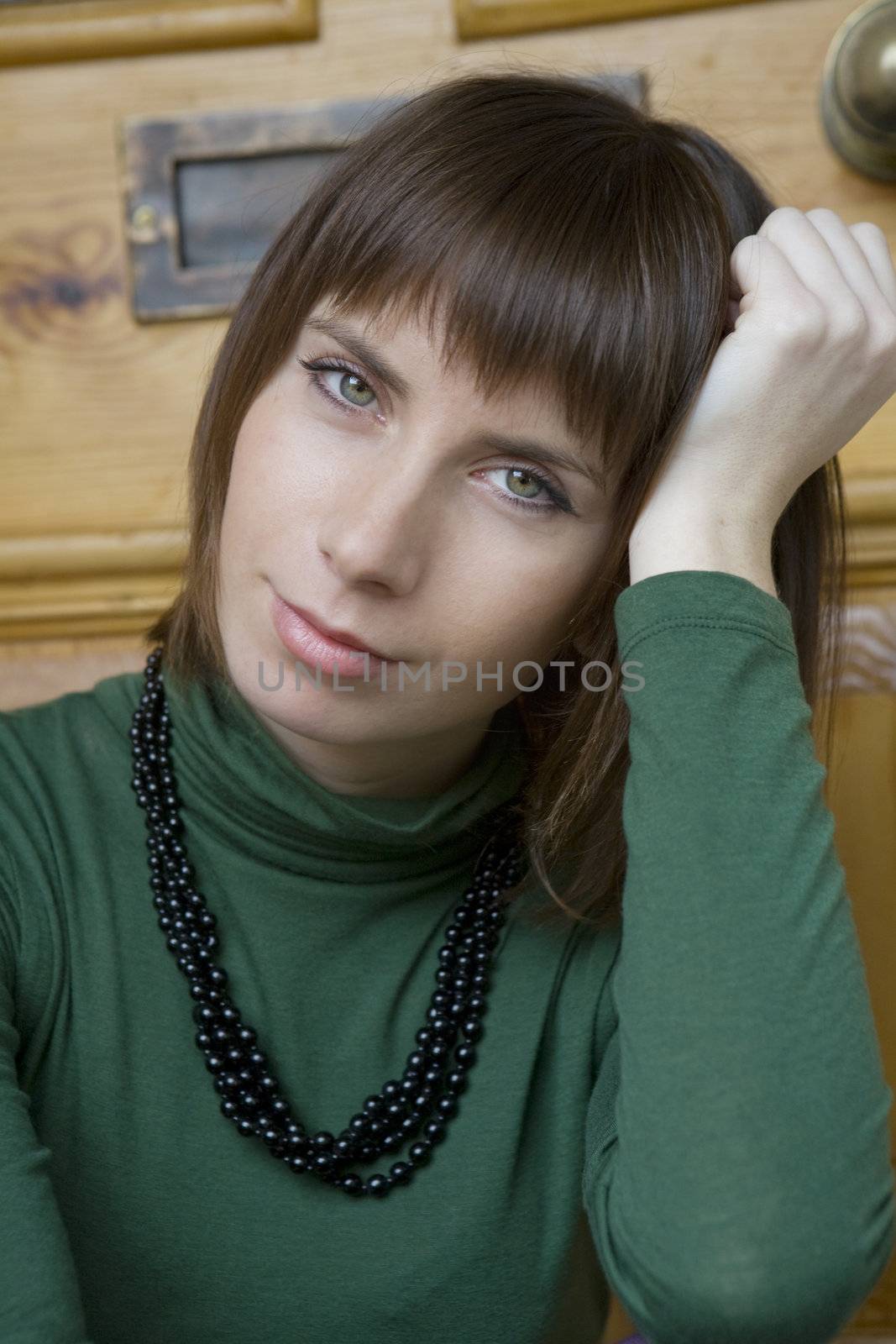 portrait young attractive woman sitting at door