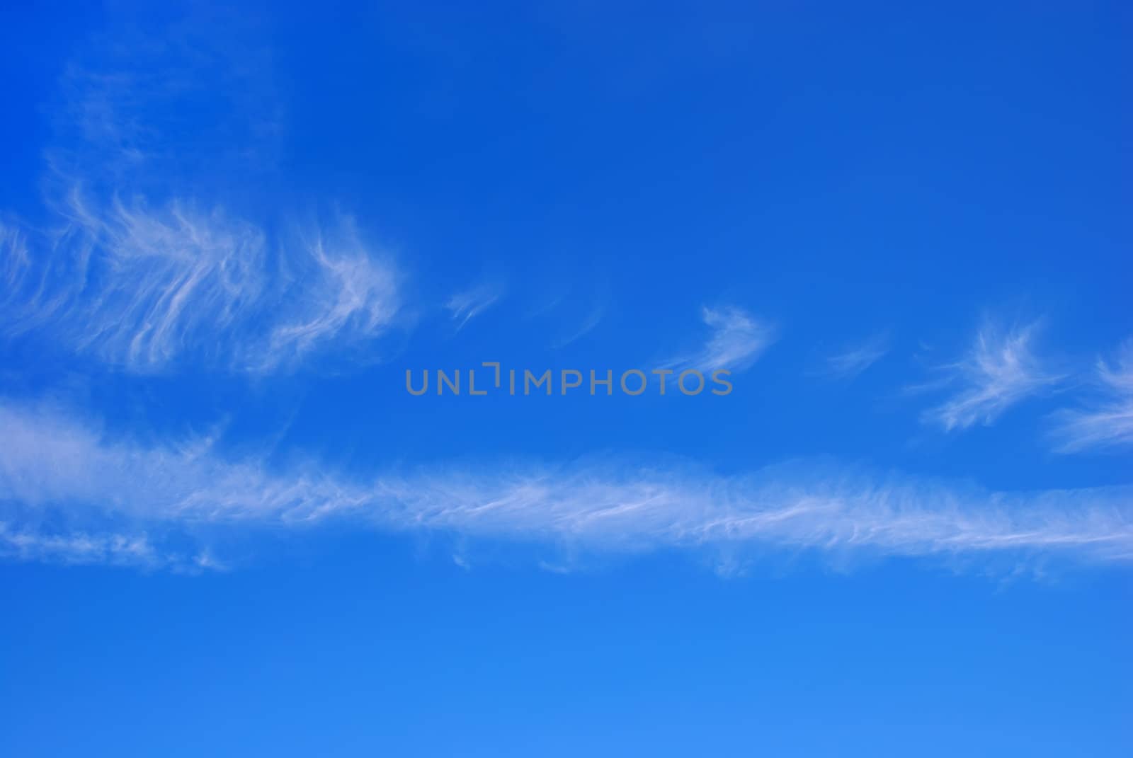 Blue sky with two horizontal white cloud stripes.