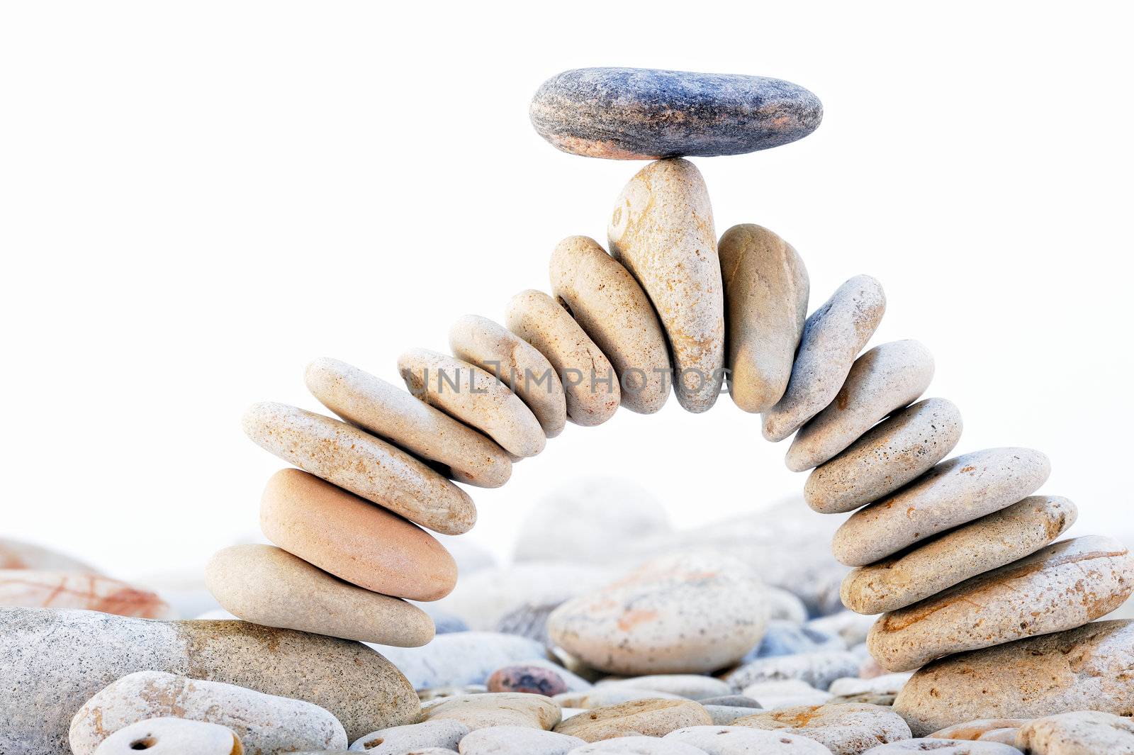 Arch of the pebbles with a black stone on top