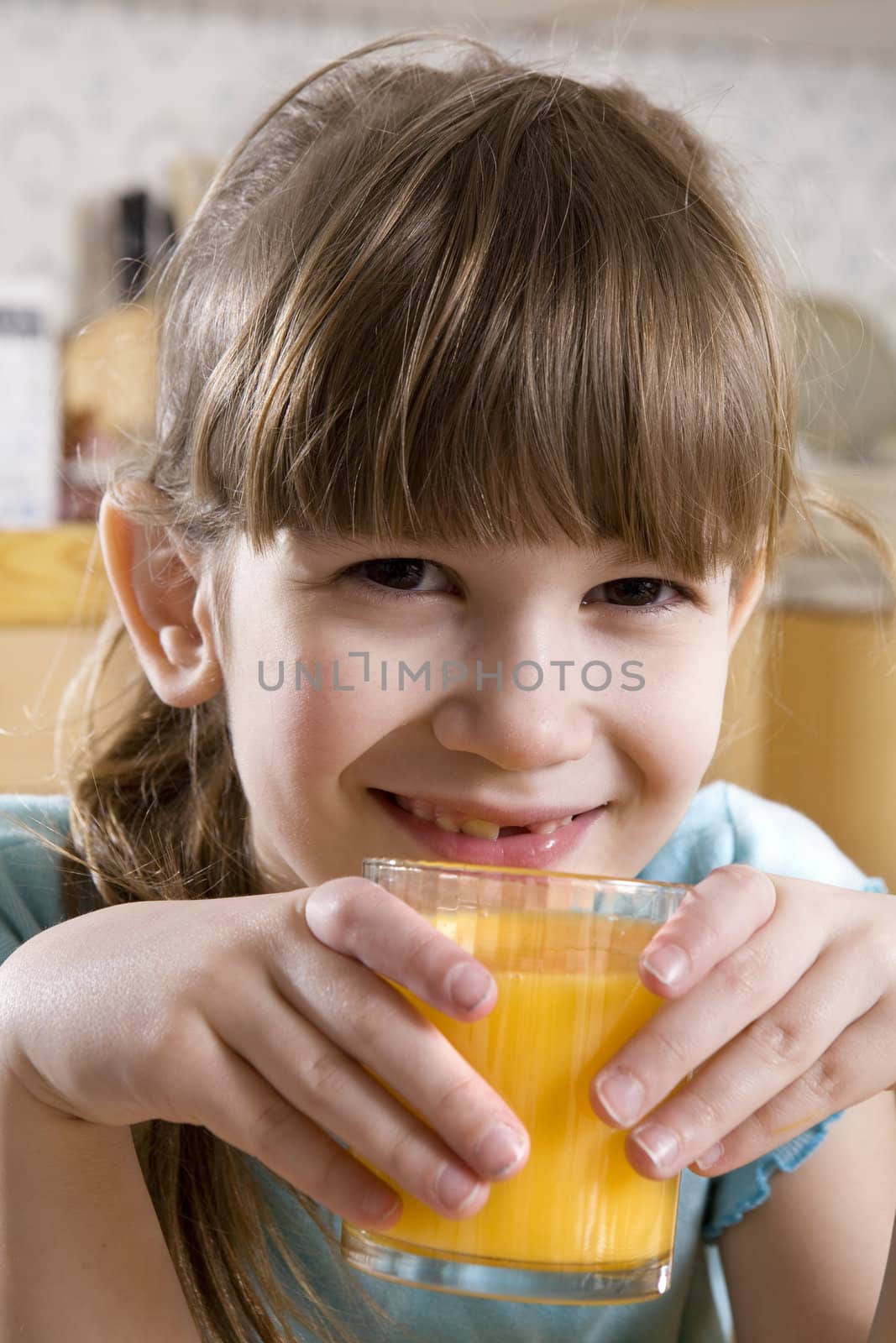 little cute adorable  girl  drink orange juice by elenarostunova