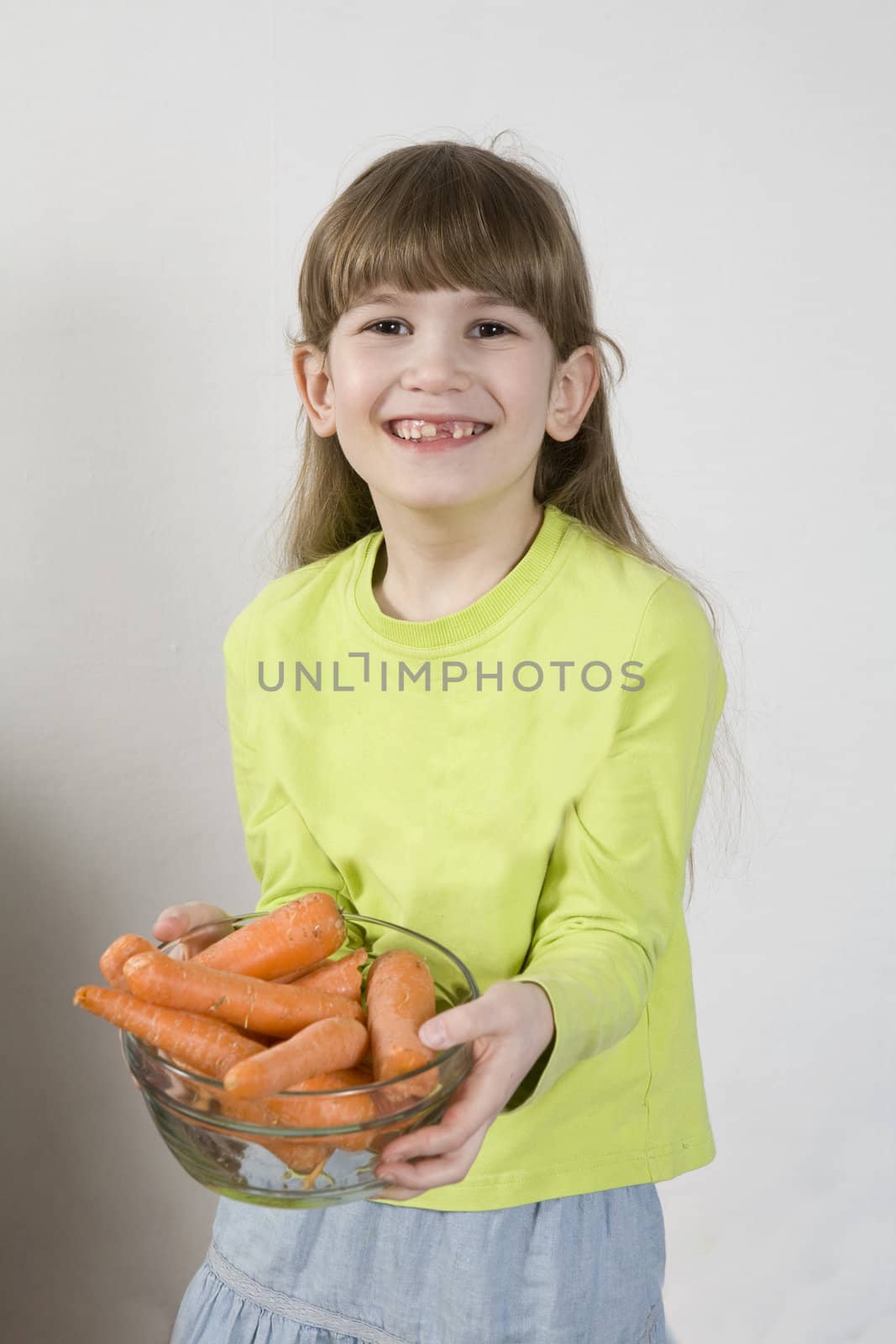 little cute girl holding carrot  by elenarostunova