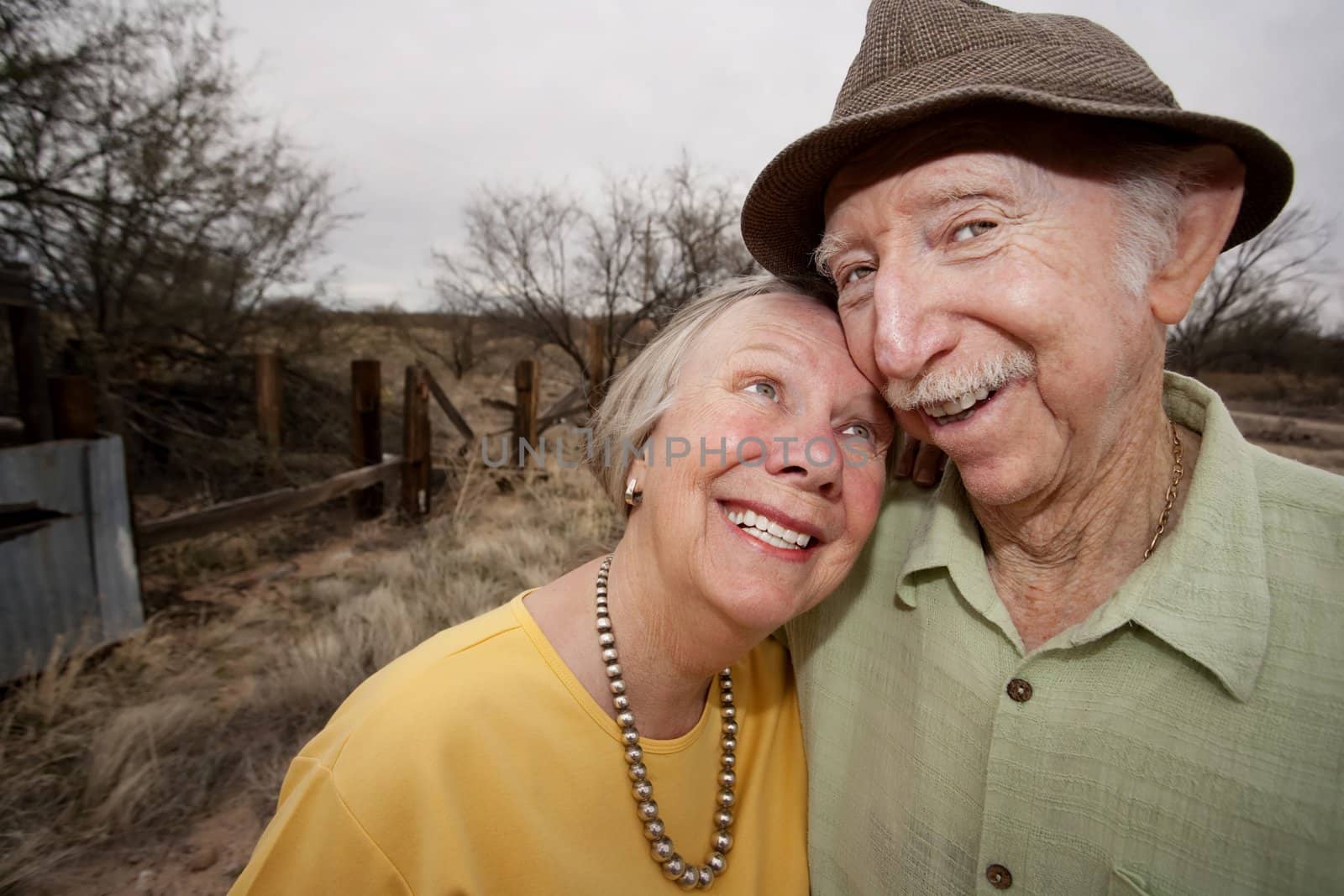 Happy Senior Couple Outdoors Smiling and Embracing