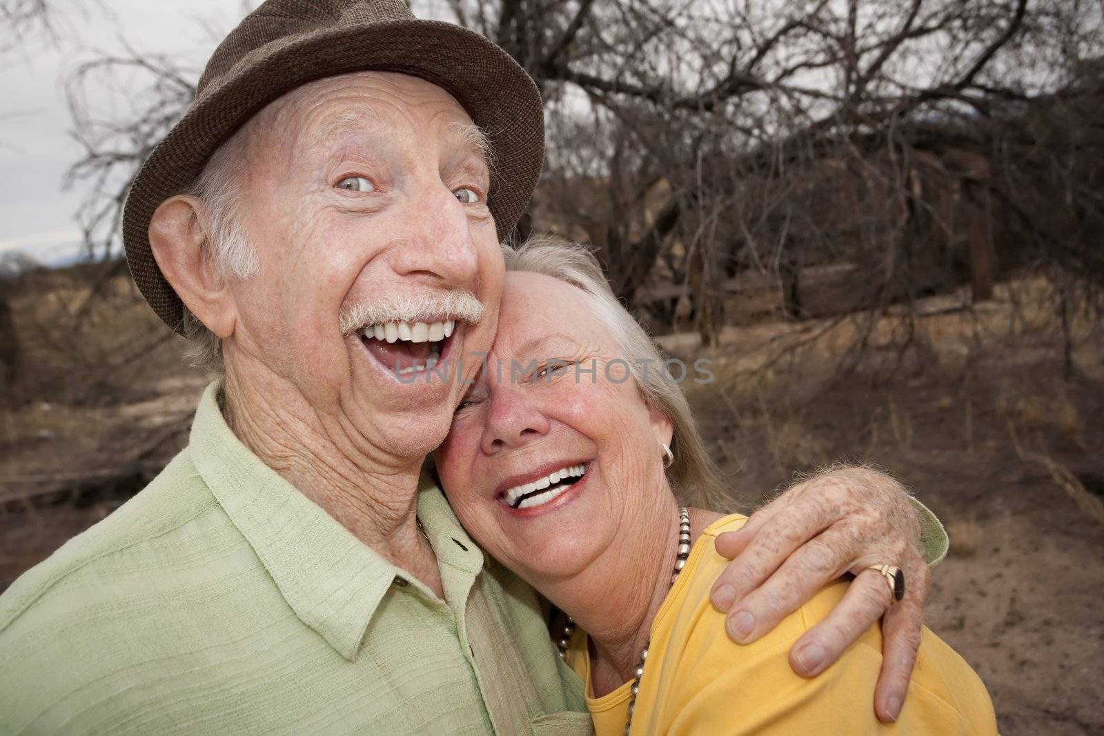 Happy Senior Couple Outdoors Smiling and Laughing