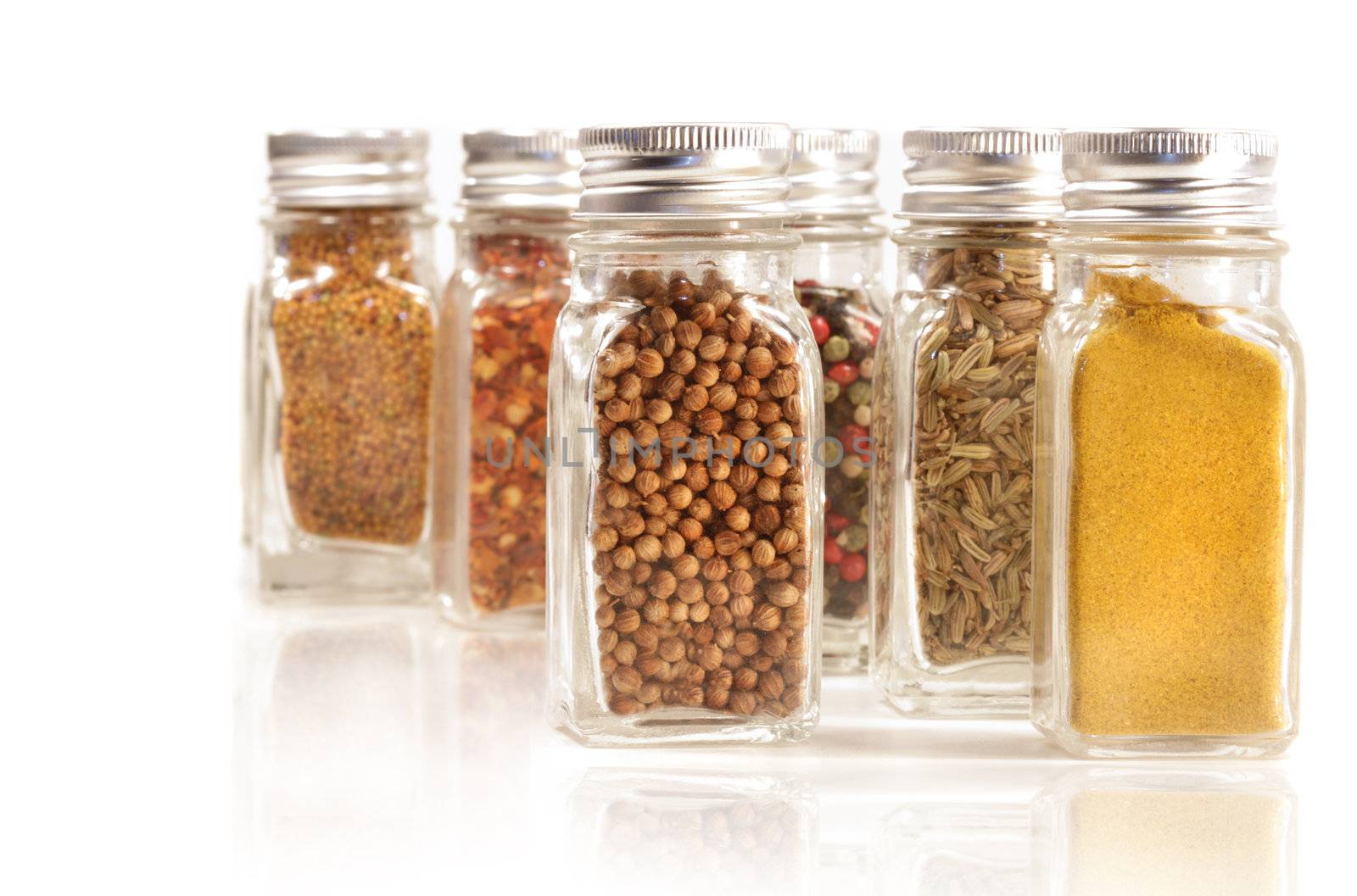 Assorted spice jars isolated on white background