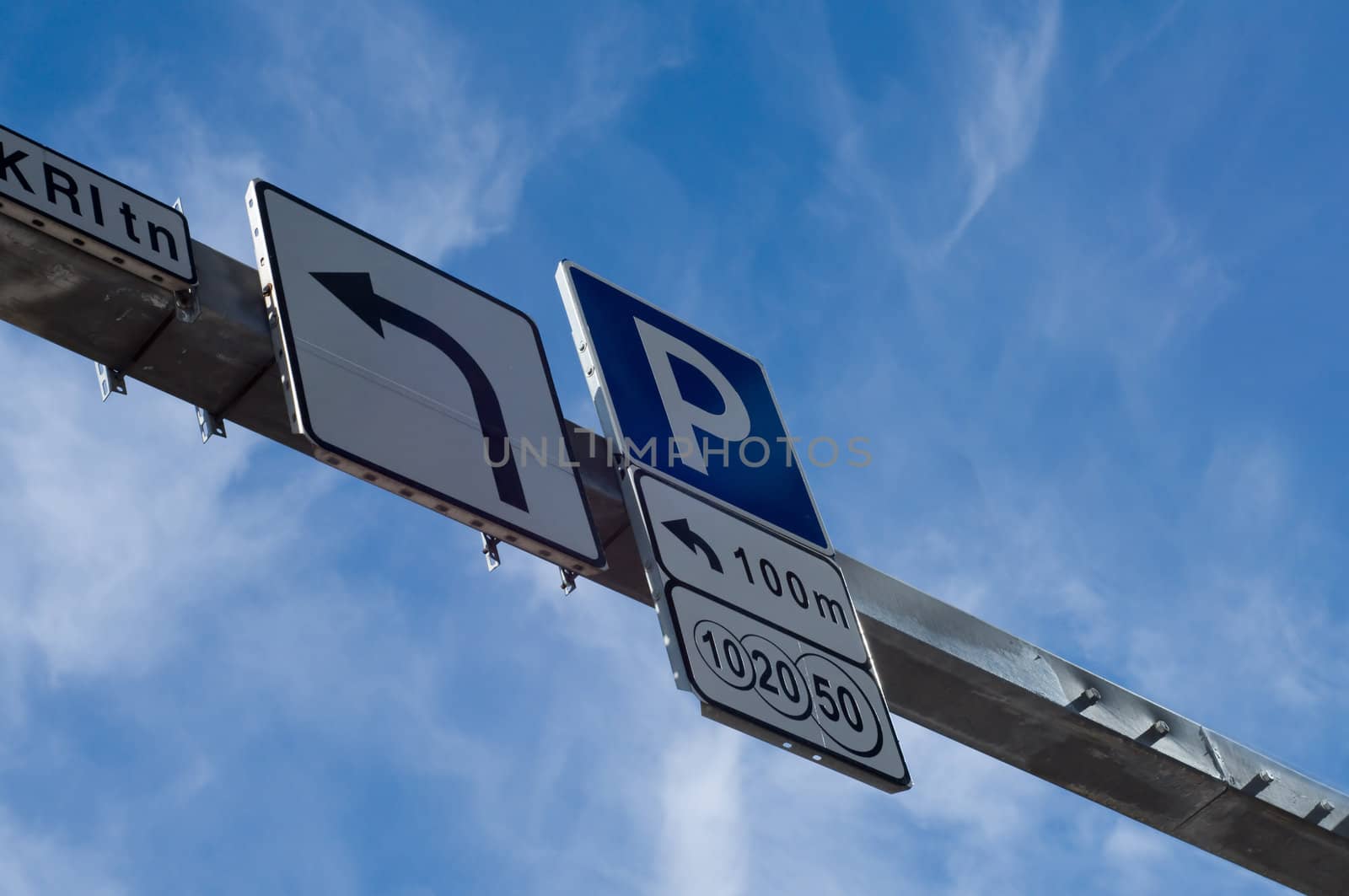 Shot of road signs, blue sky, downtown