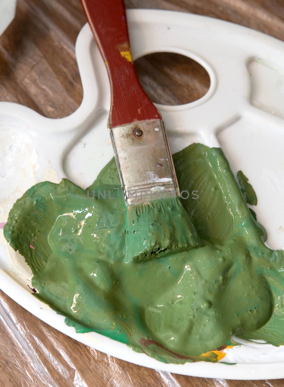 Artist brush with green paint