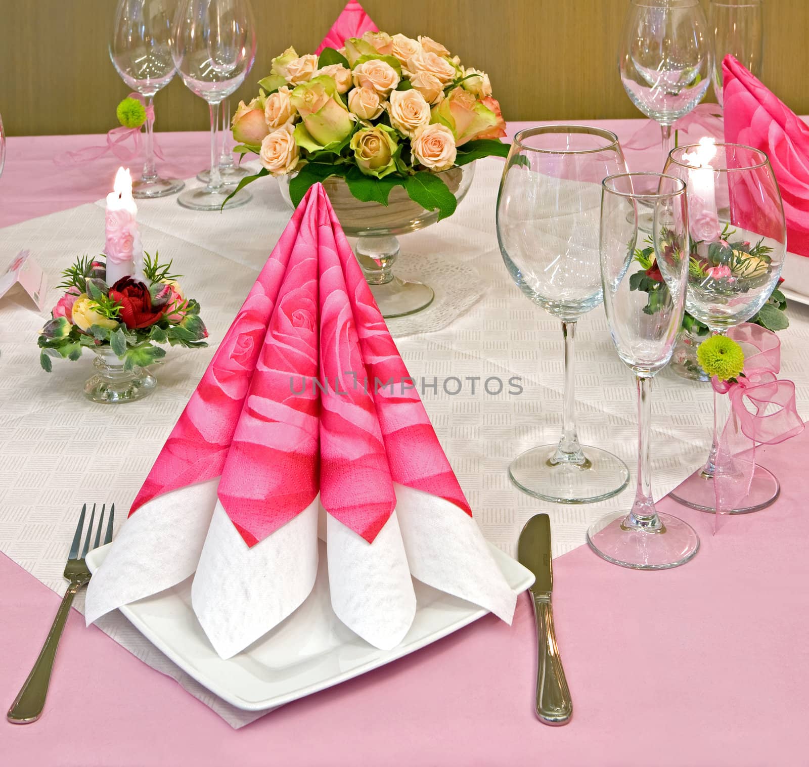 Wedding table decorated with bouquet and candles
