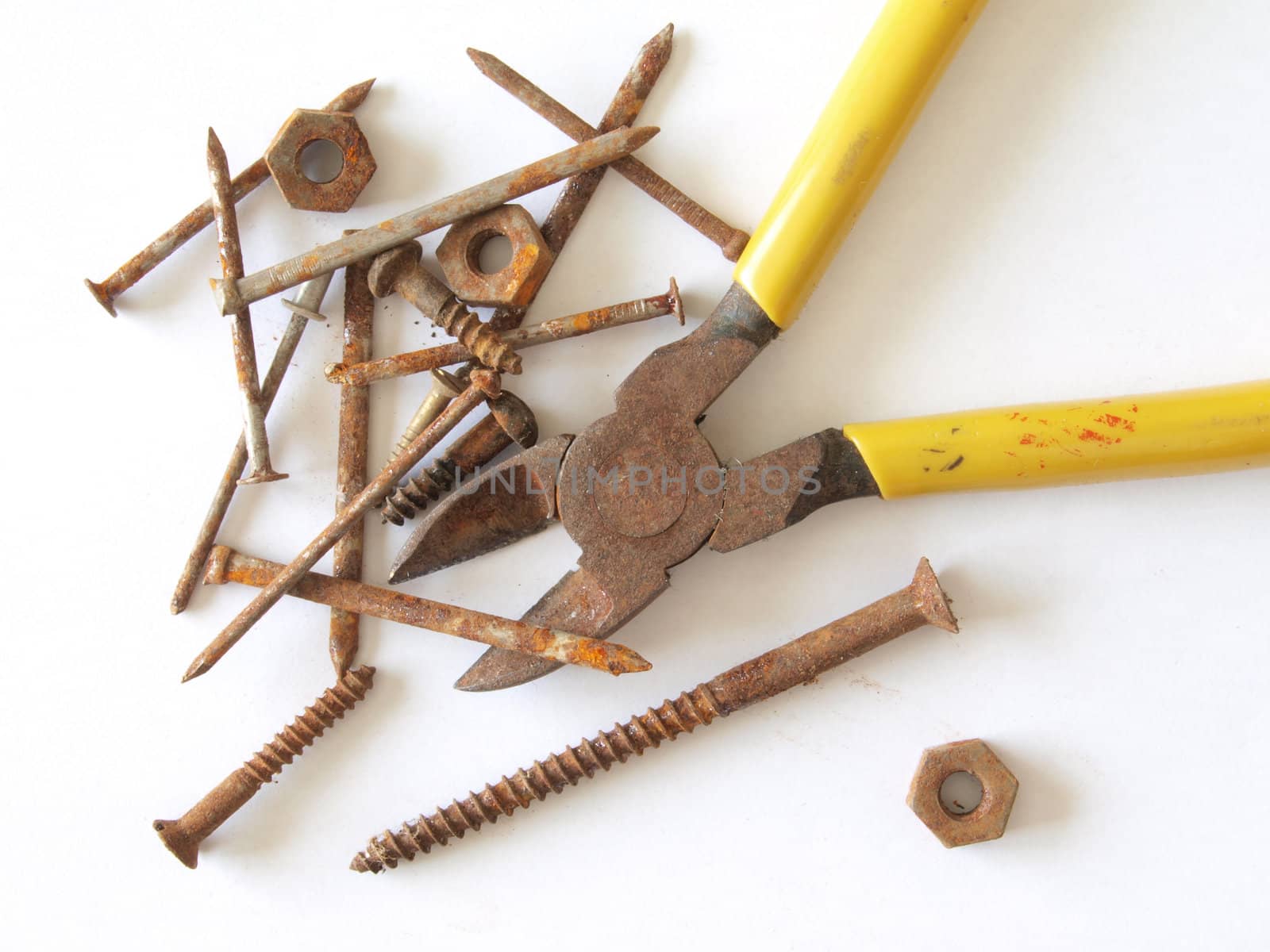 Rusty tools, screws, nails, nuts and bolts.