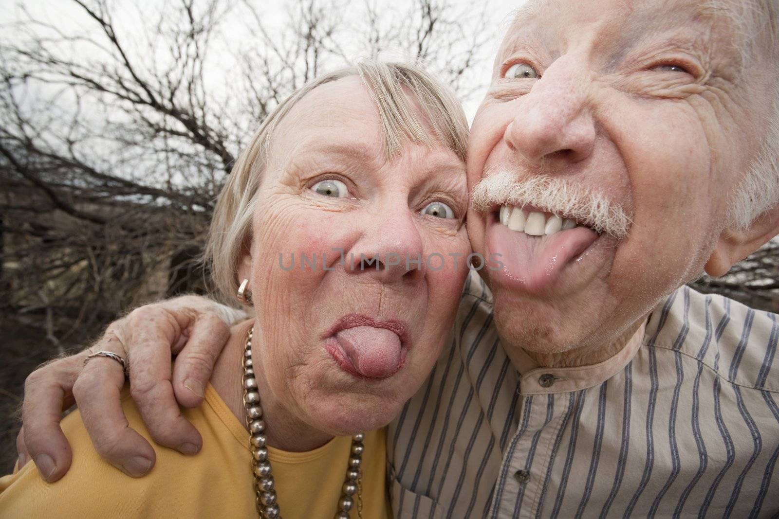 Crazy Couple Sticking Out Tongues by Creatista