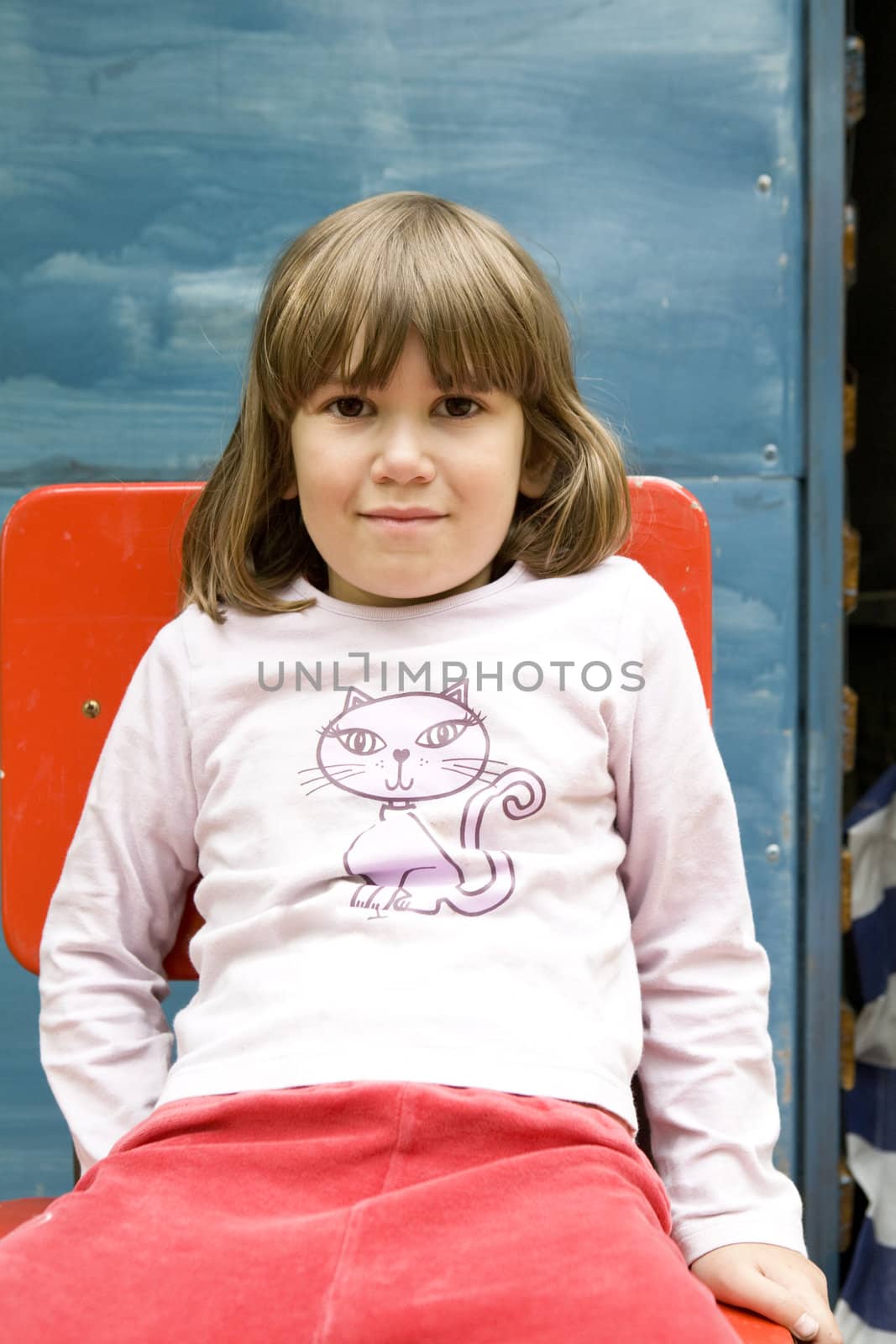 portrait young cute girl sitting on chair
