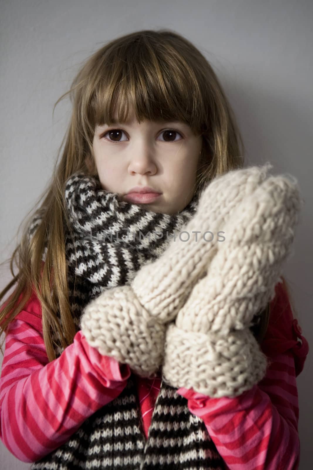 little cute upset  girl with scarf by elenarostunova