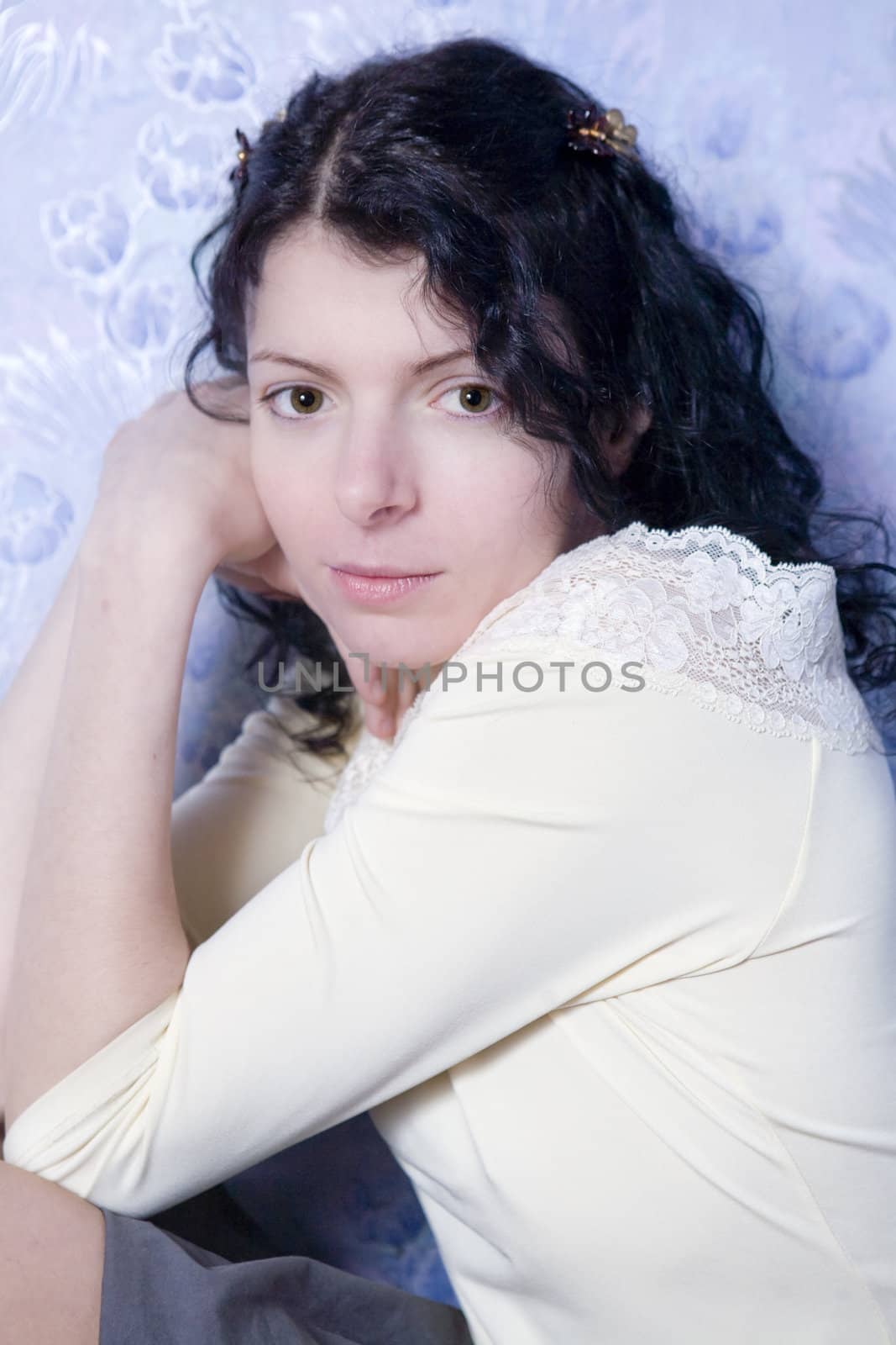 curl attractive young brunette woman looking at camera