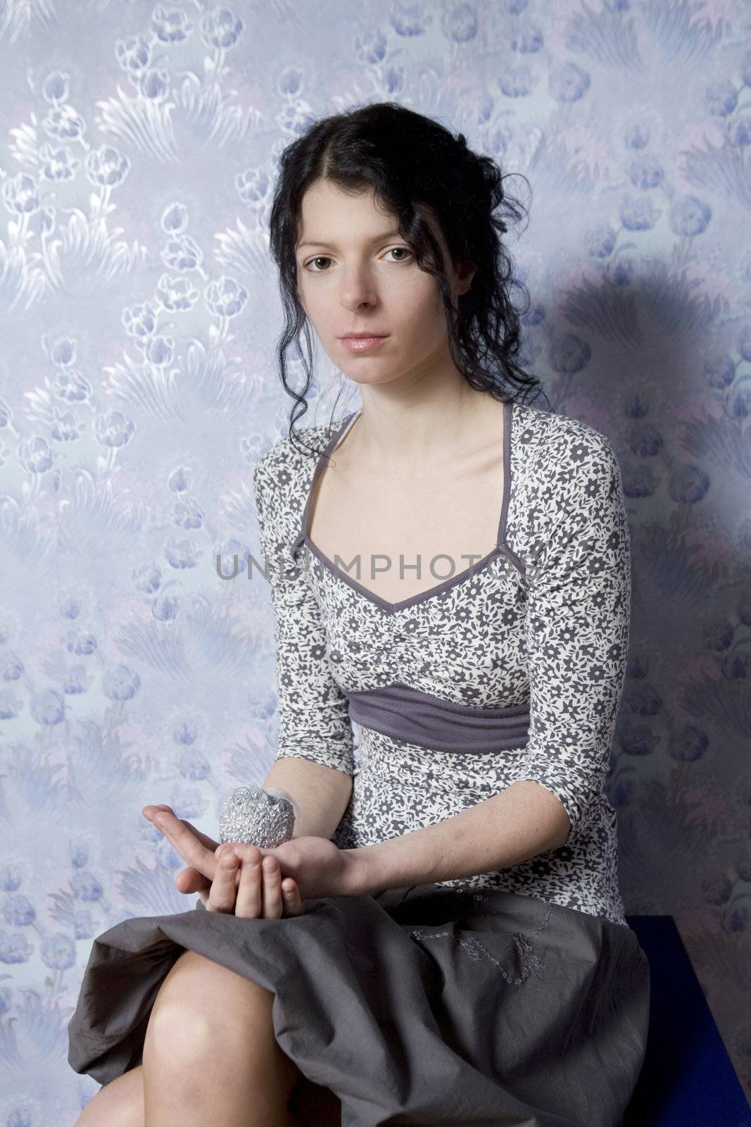 portrait young attractive curl woman with silver apple