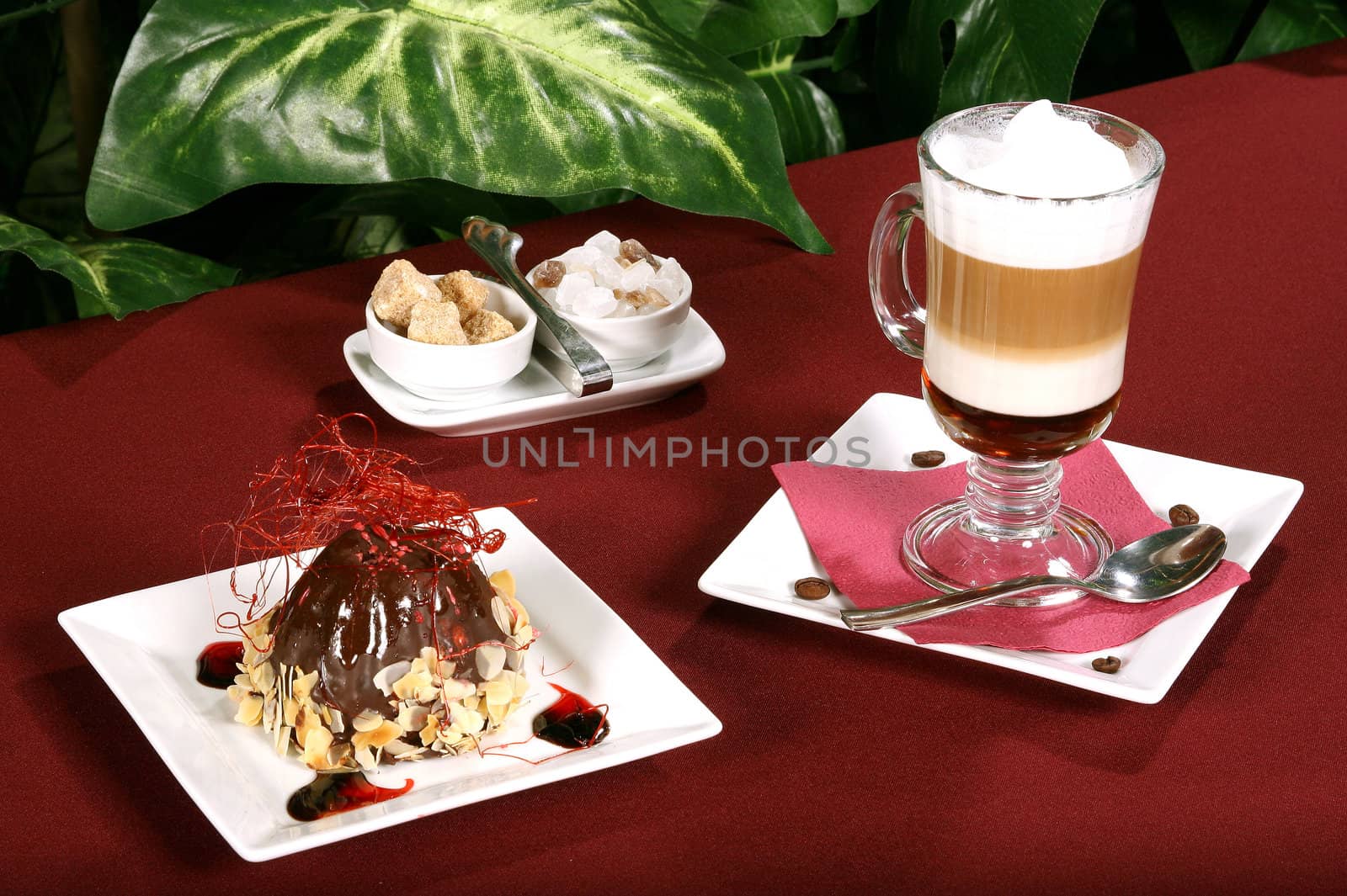 Cup of coffee and cake on a table in cafe