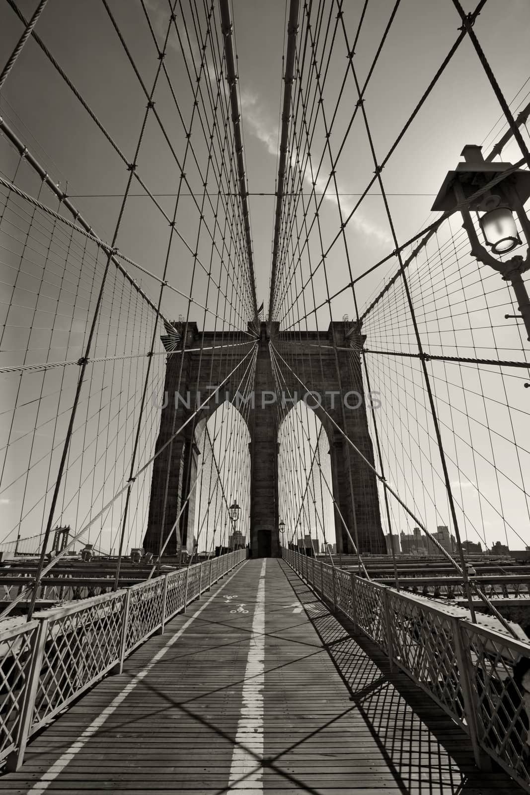 Photo of the Brooklyn Bridge in New York city done in black and white.
